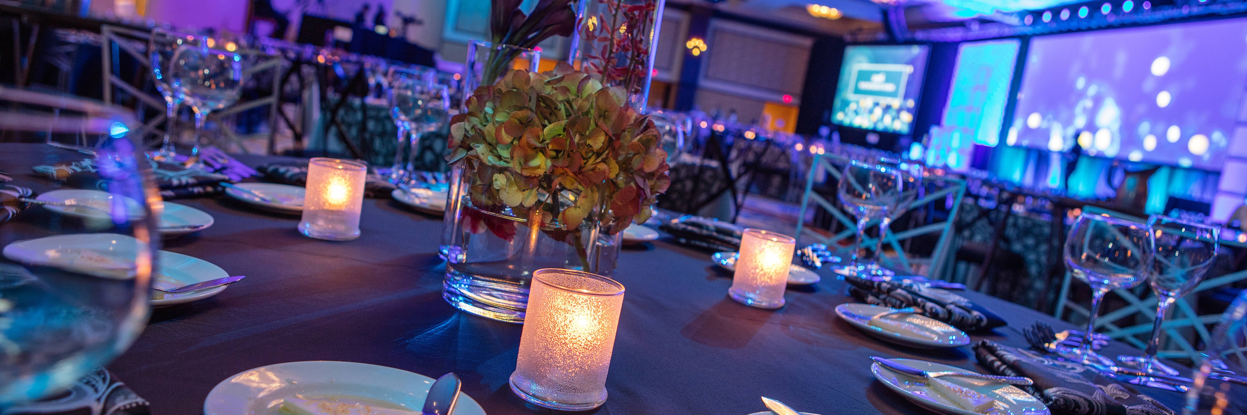 Ballroom banquet with blue and purple lighting