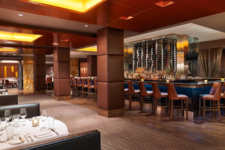 Roast restaurant with bar set with stools.