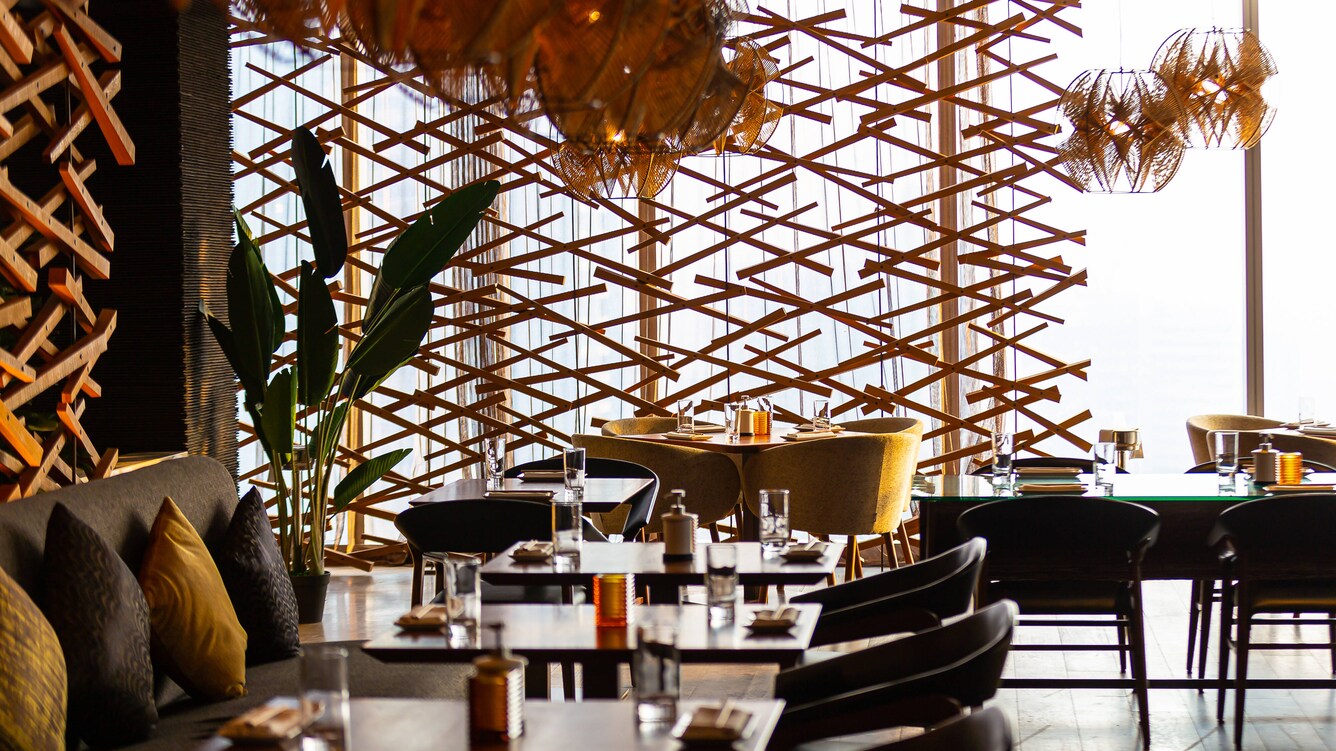 Dim dining area with natural decor.