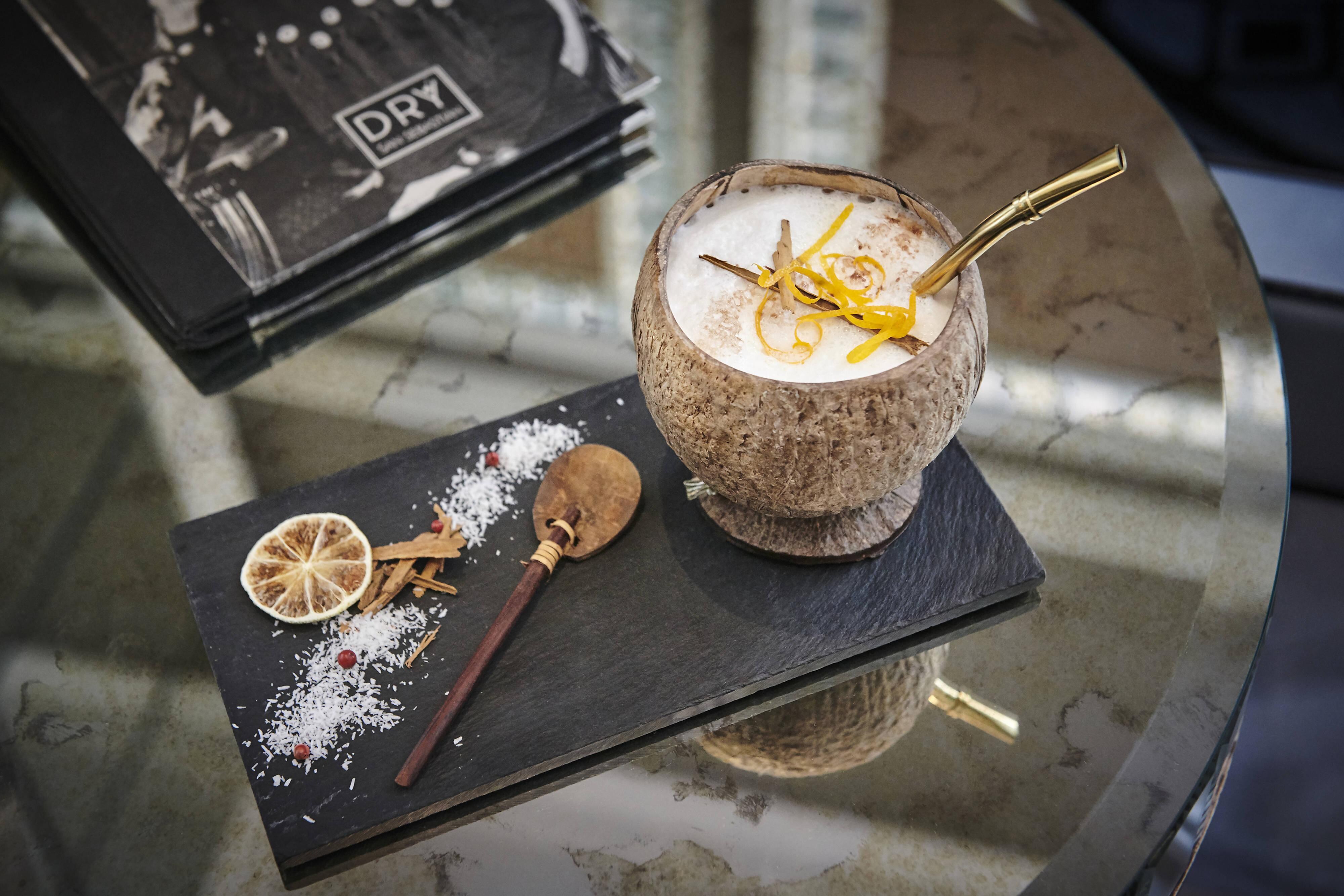 A cocktail served with garnishes