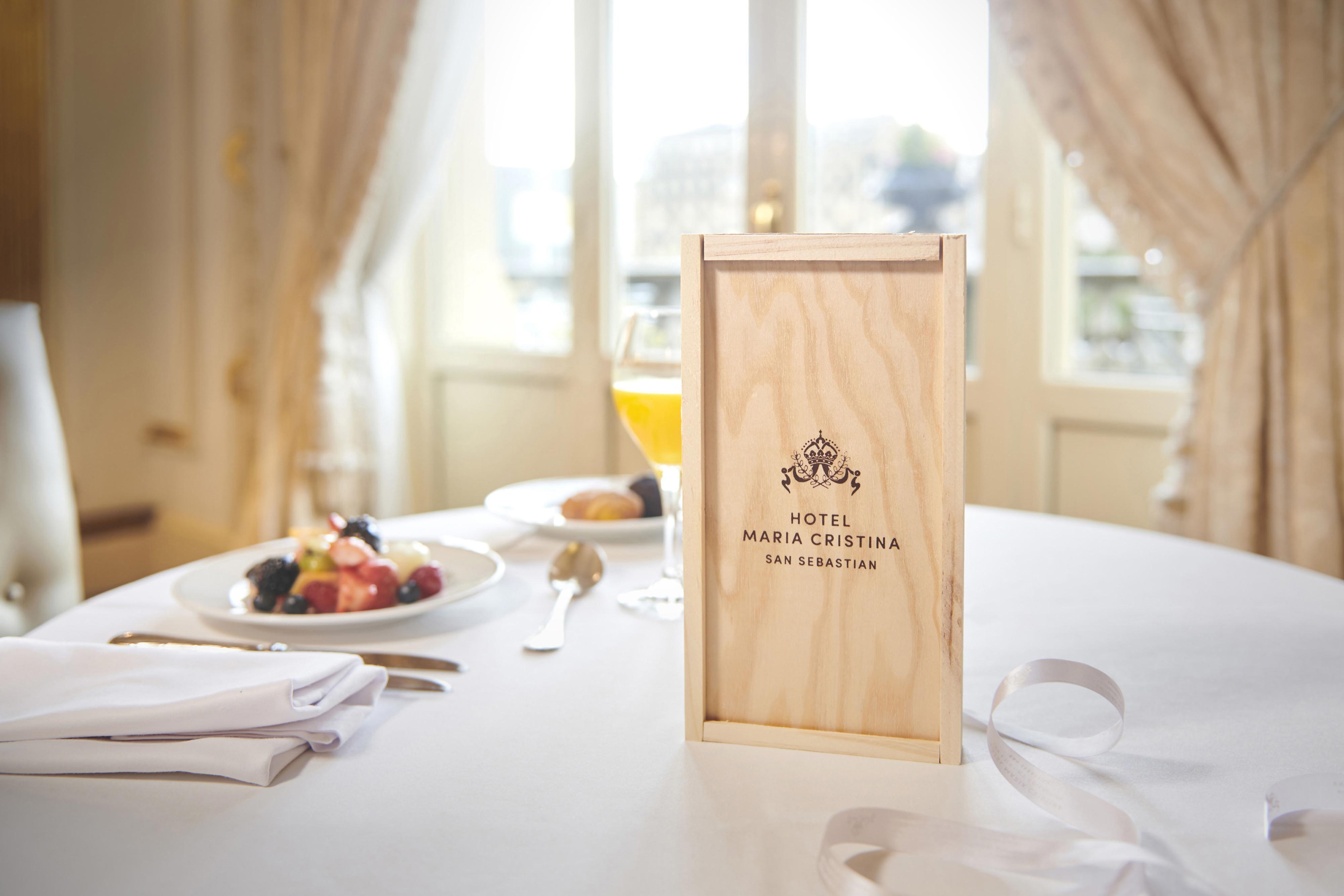 A wooden gift box on a breakfast table