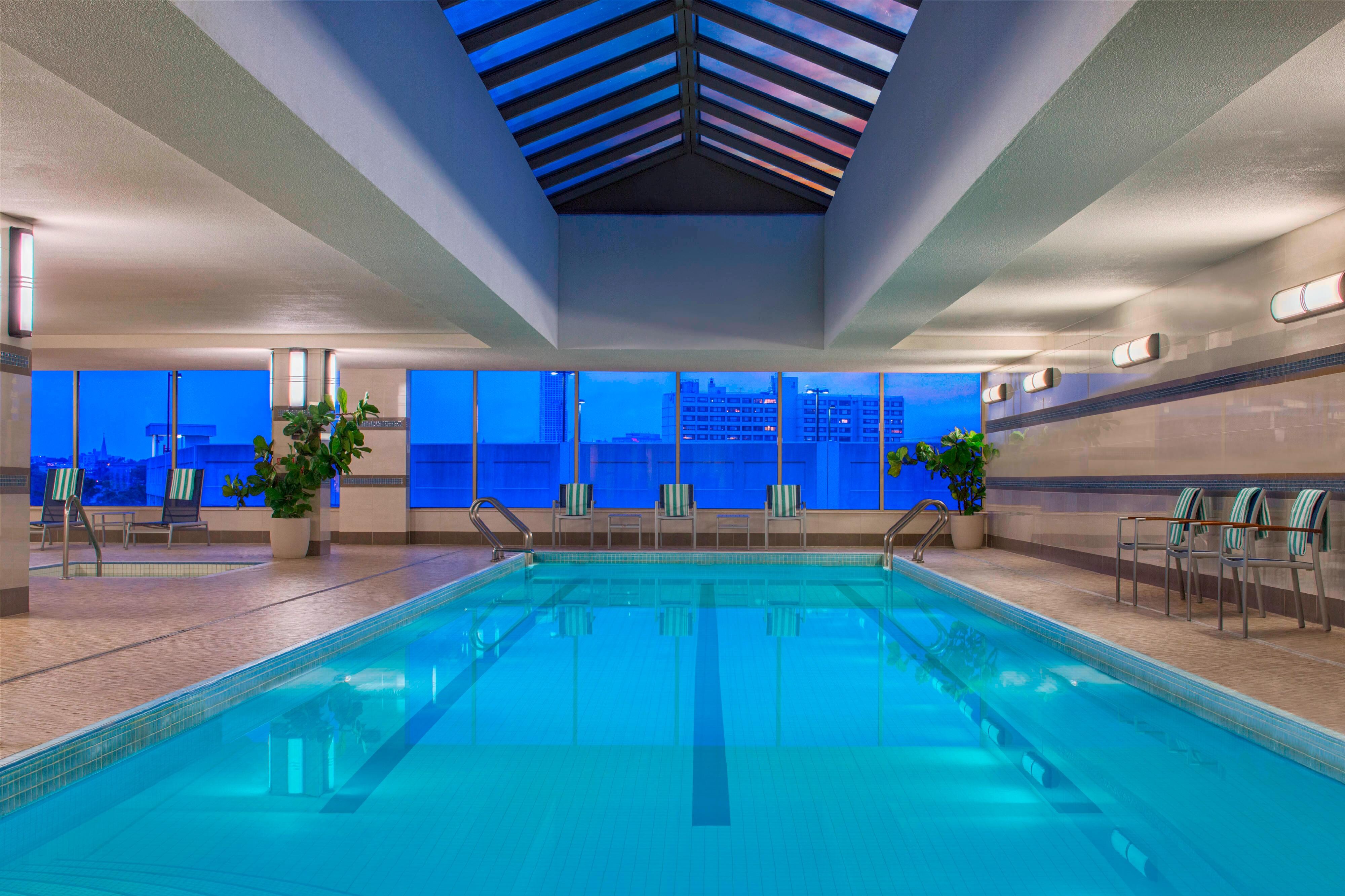 Indoor pool with windows of city view