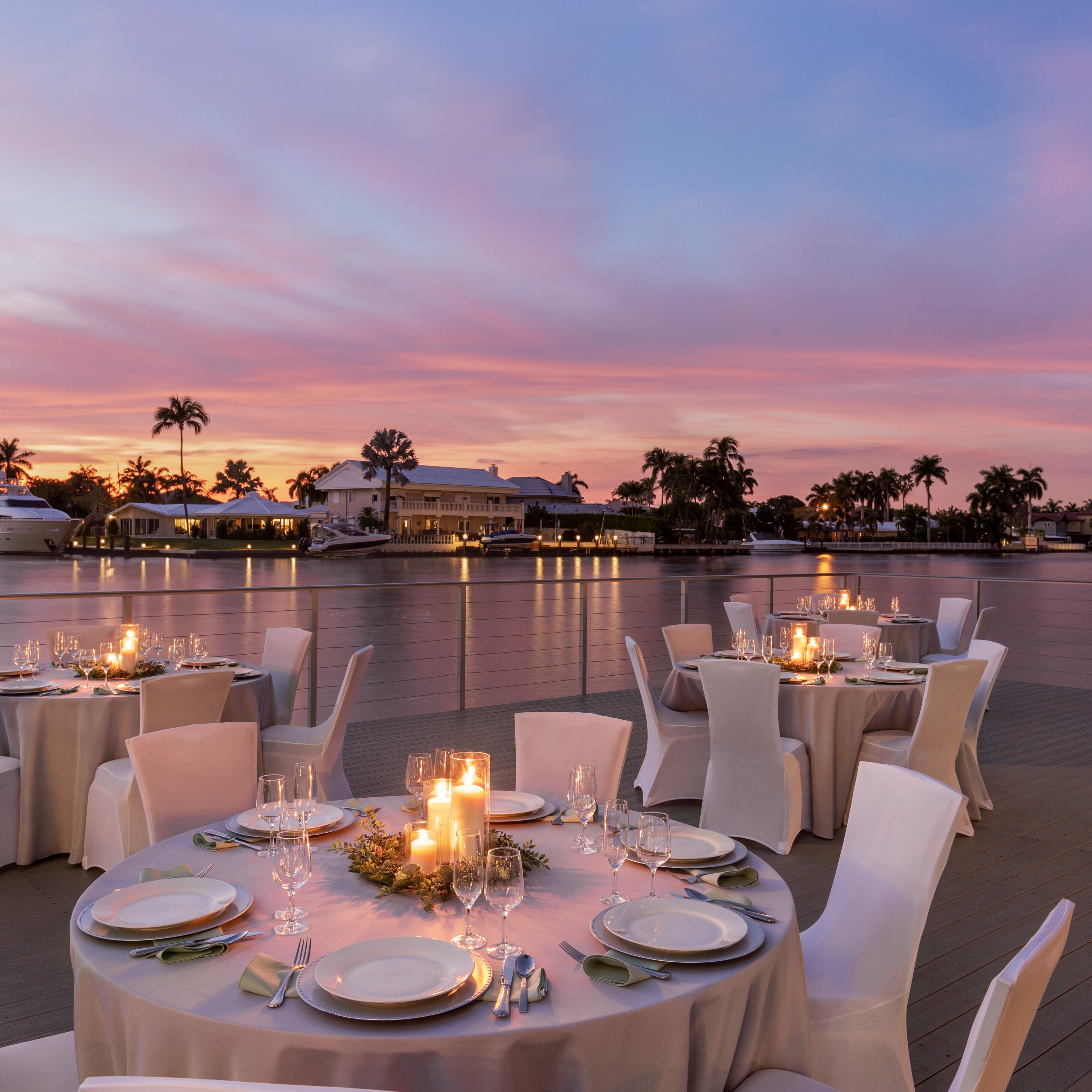 Outdoor reception at sunset by the water