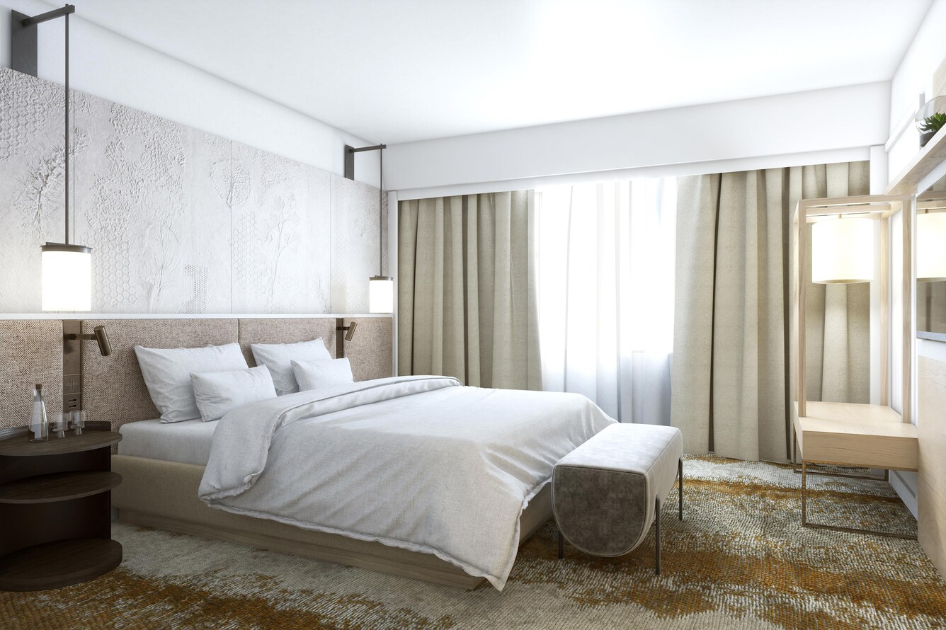 Room with King bed and nightstand next to large window.