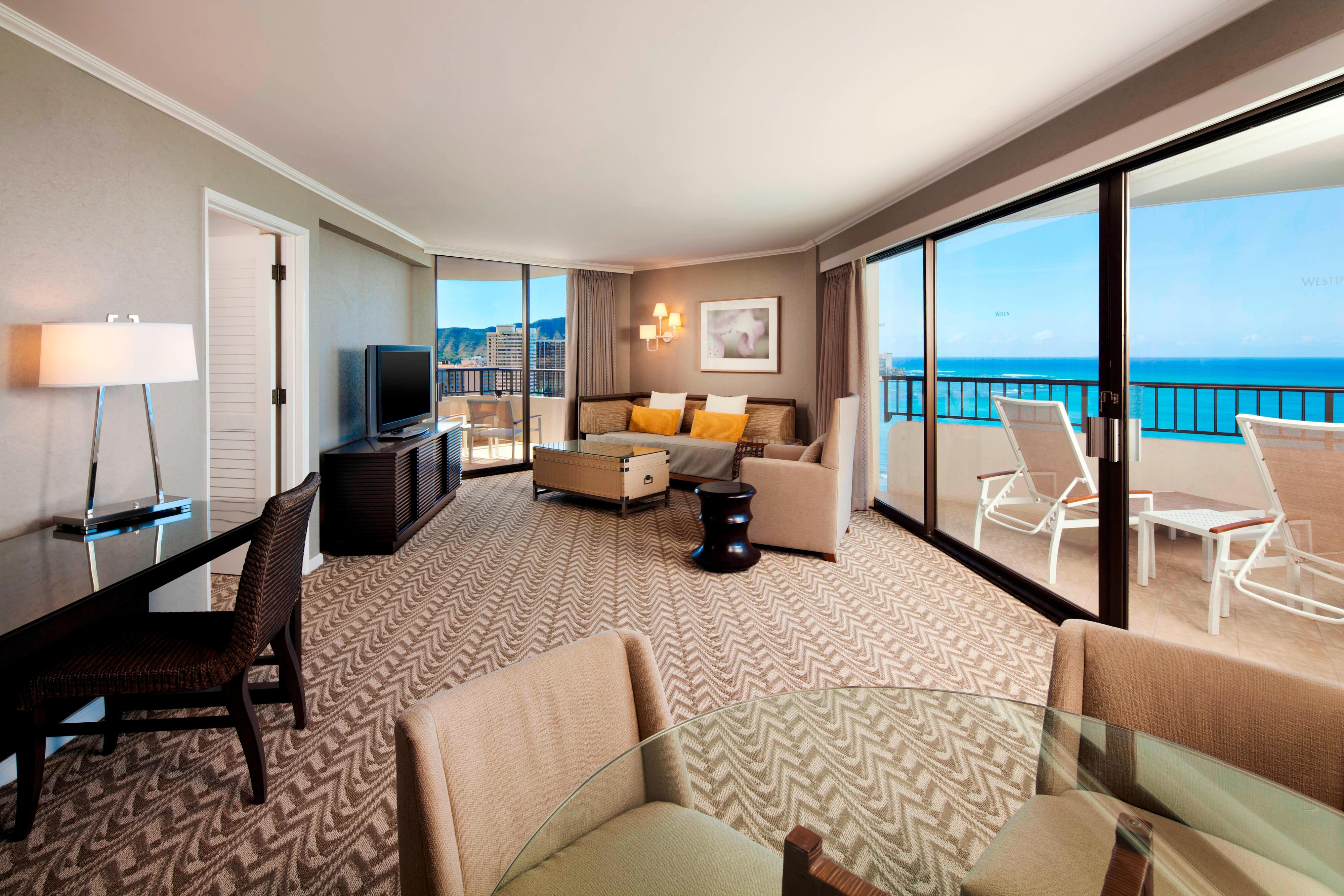 Guest suite living room and balcony with ocean views