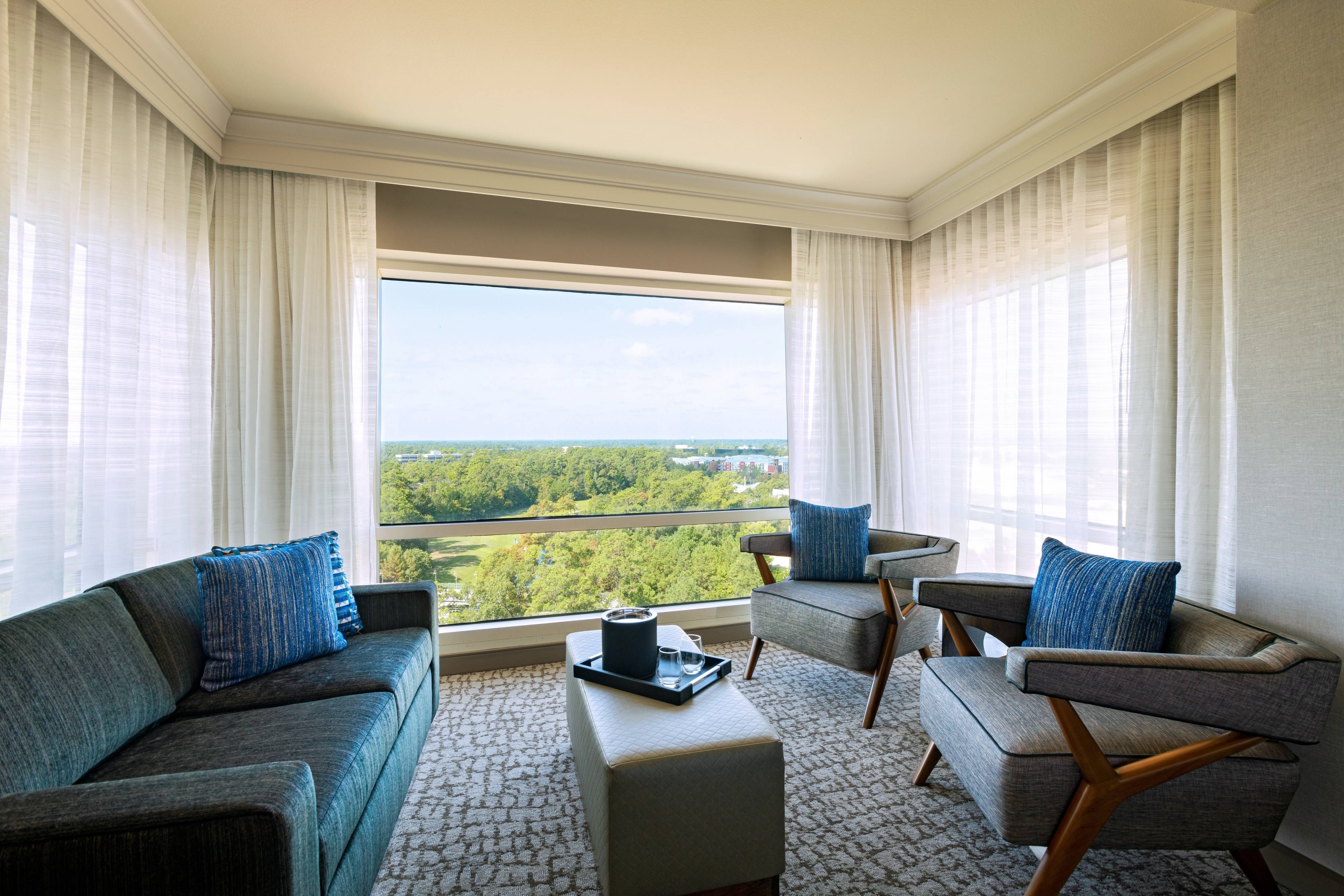 Couch chairs and window with view