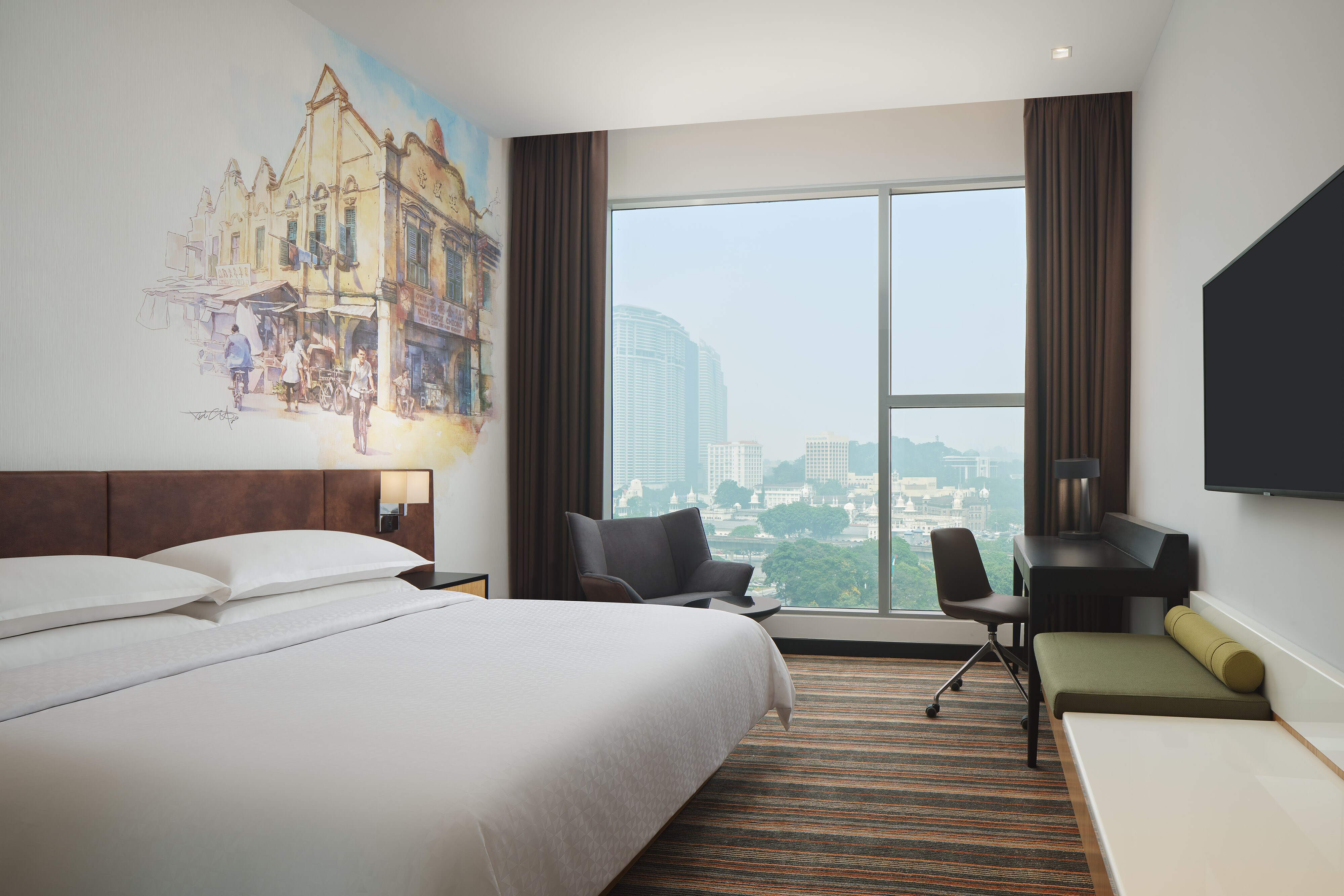 King bed with wall art and city view
