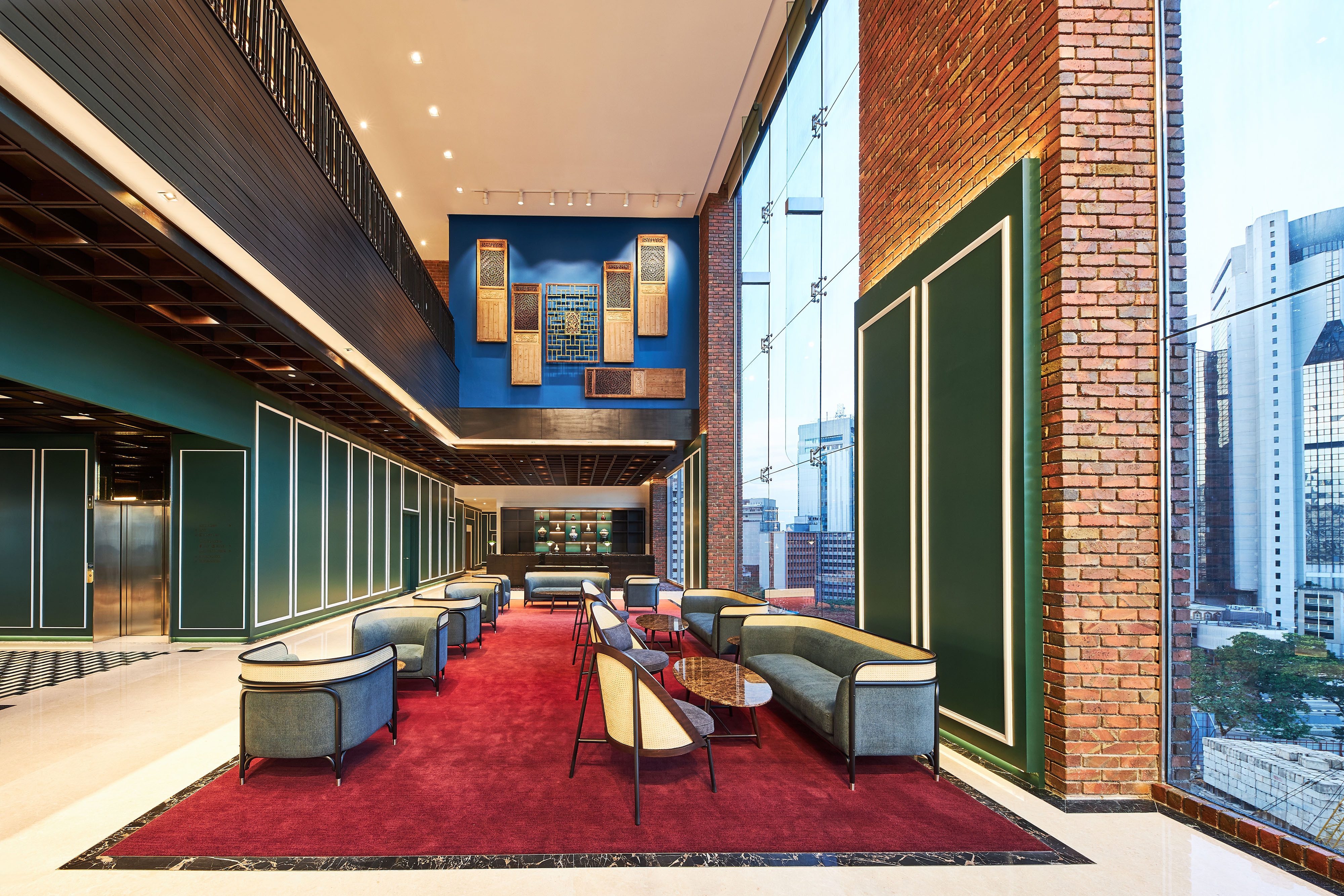 Reception seating area with floor to ceiling windows