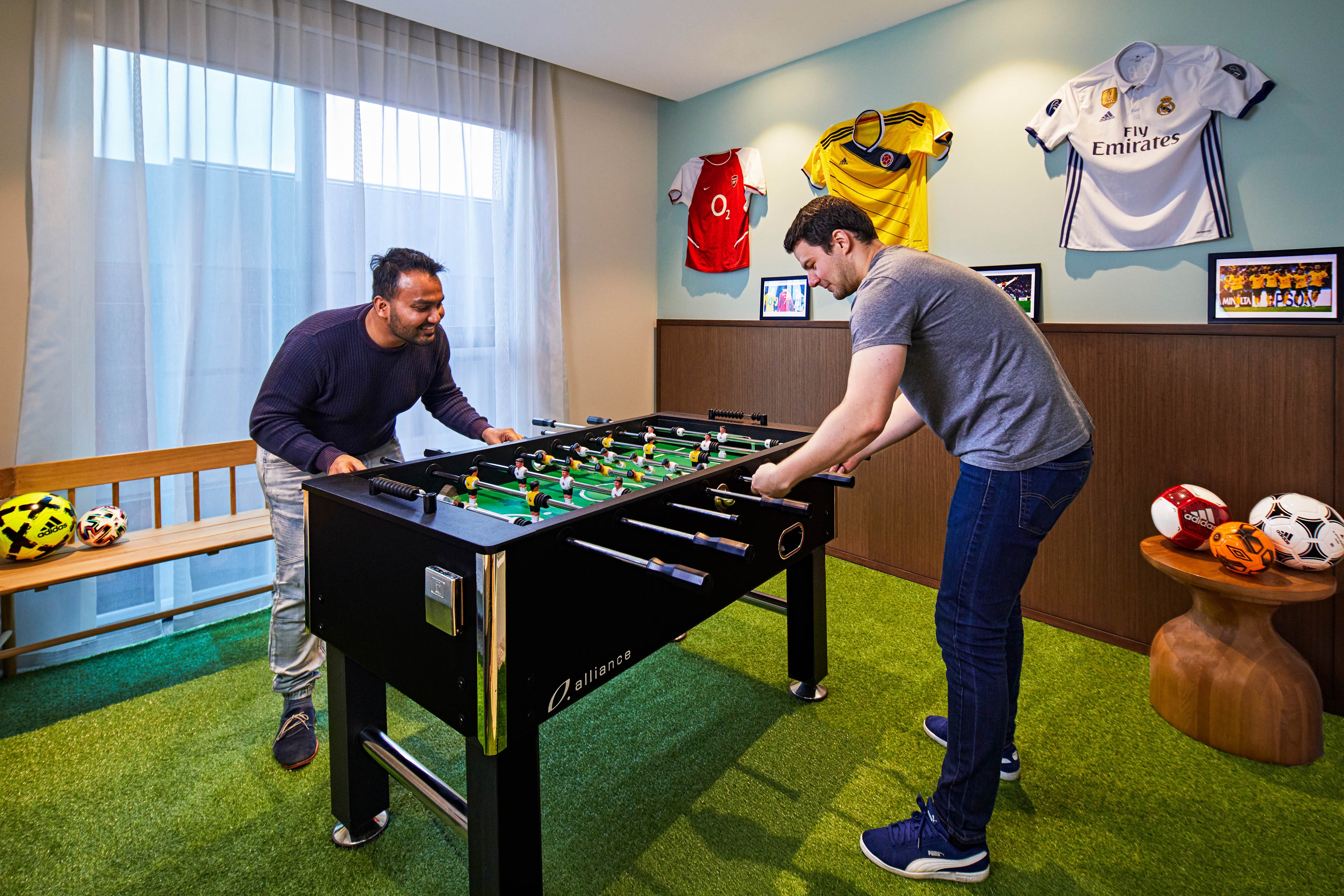 friends playing foosball