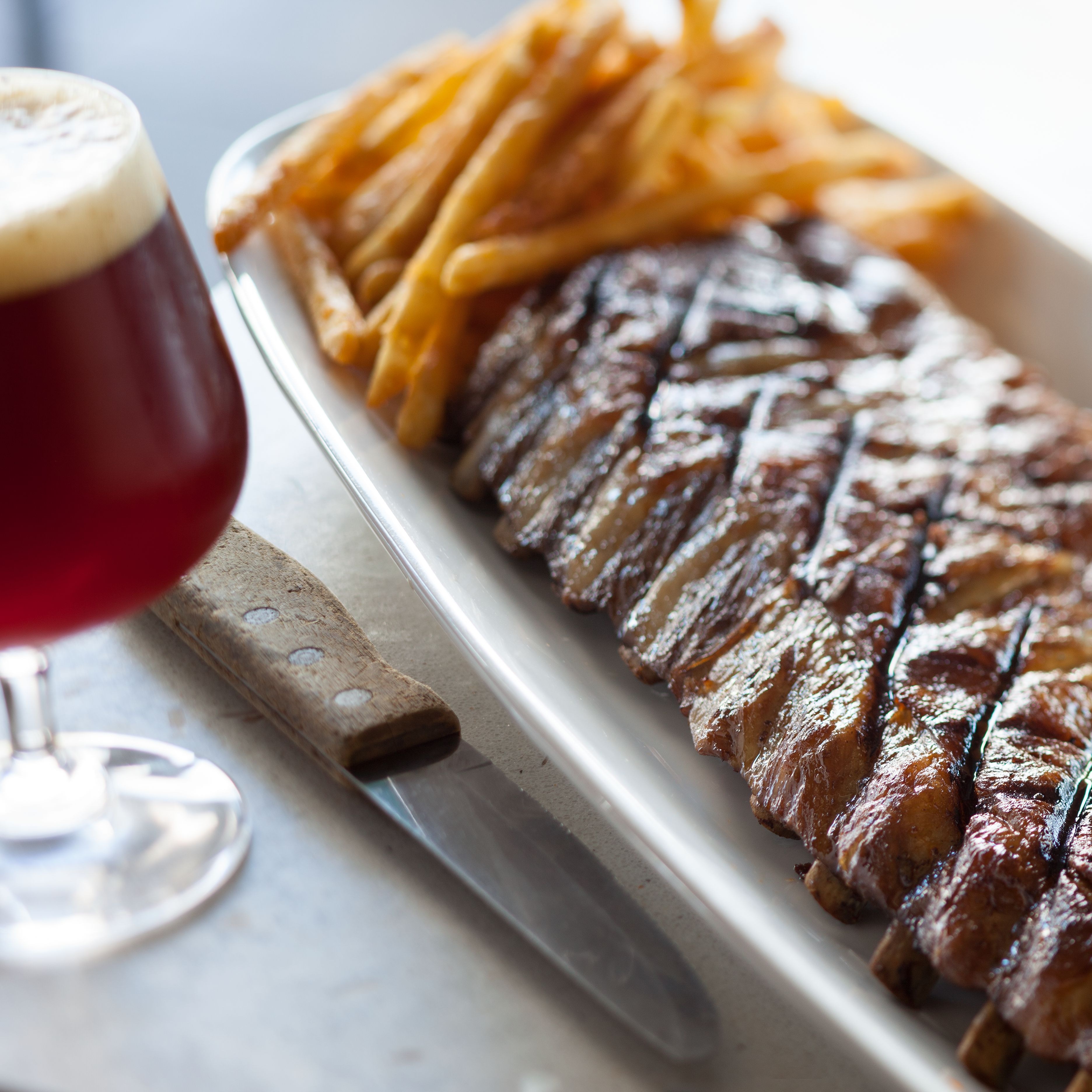 Ribs and fries with beer.