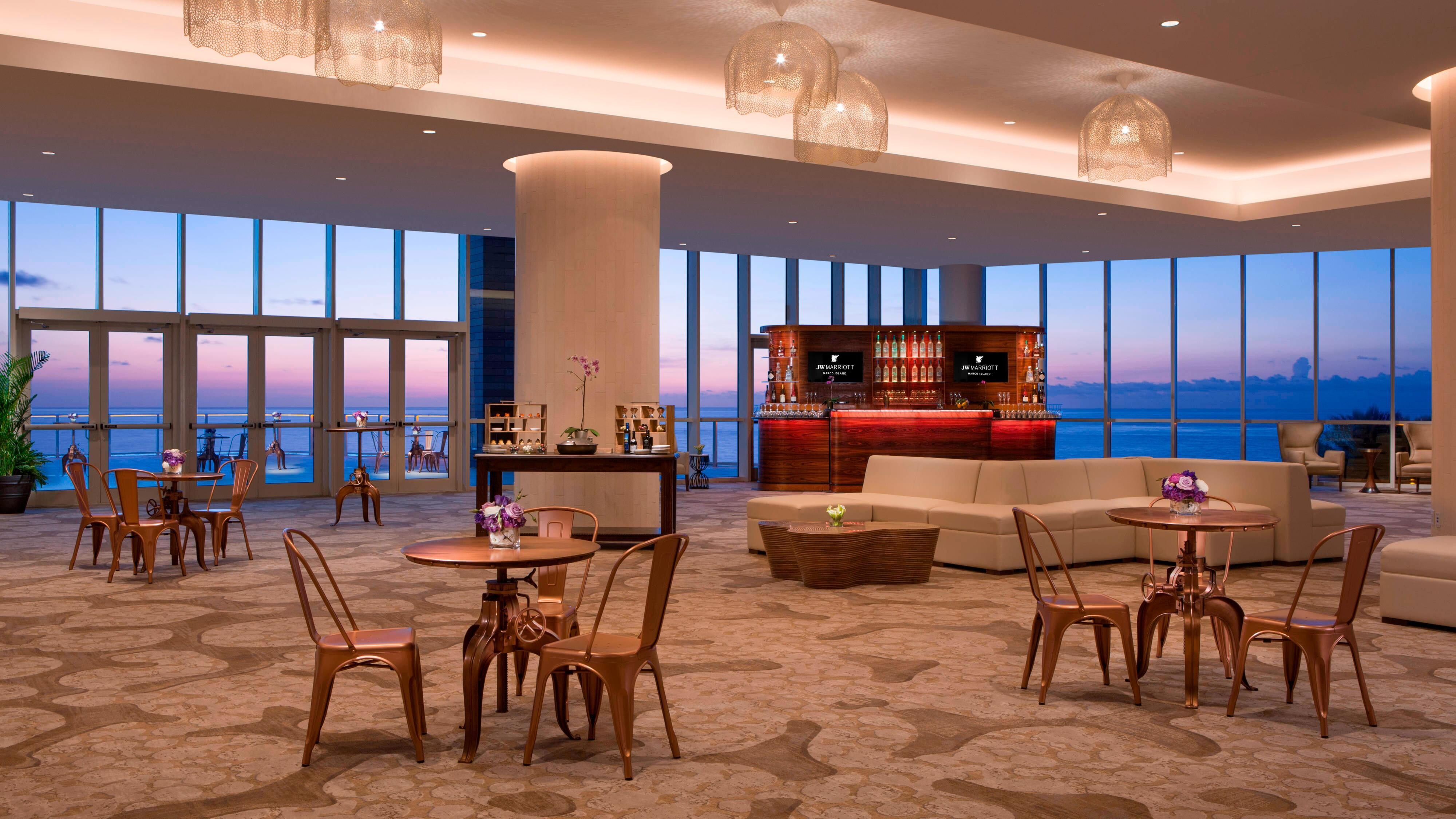Foyer reception with floor to ceiling windows.