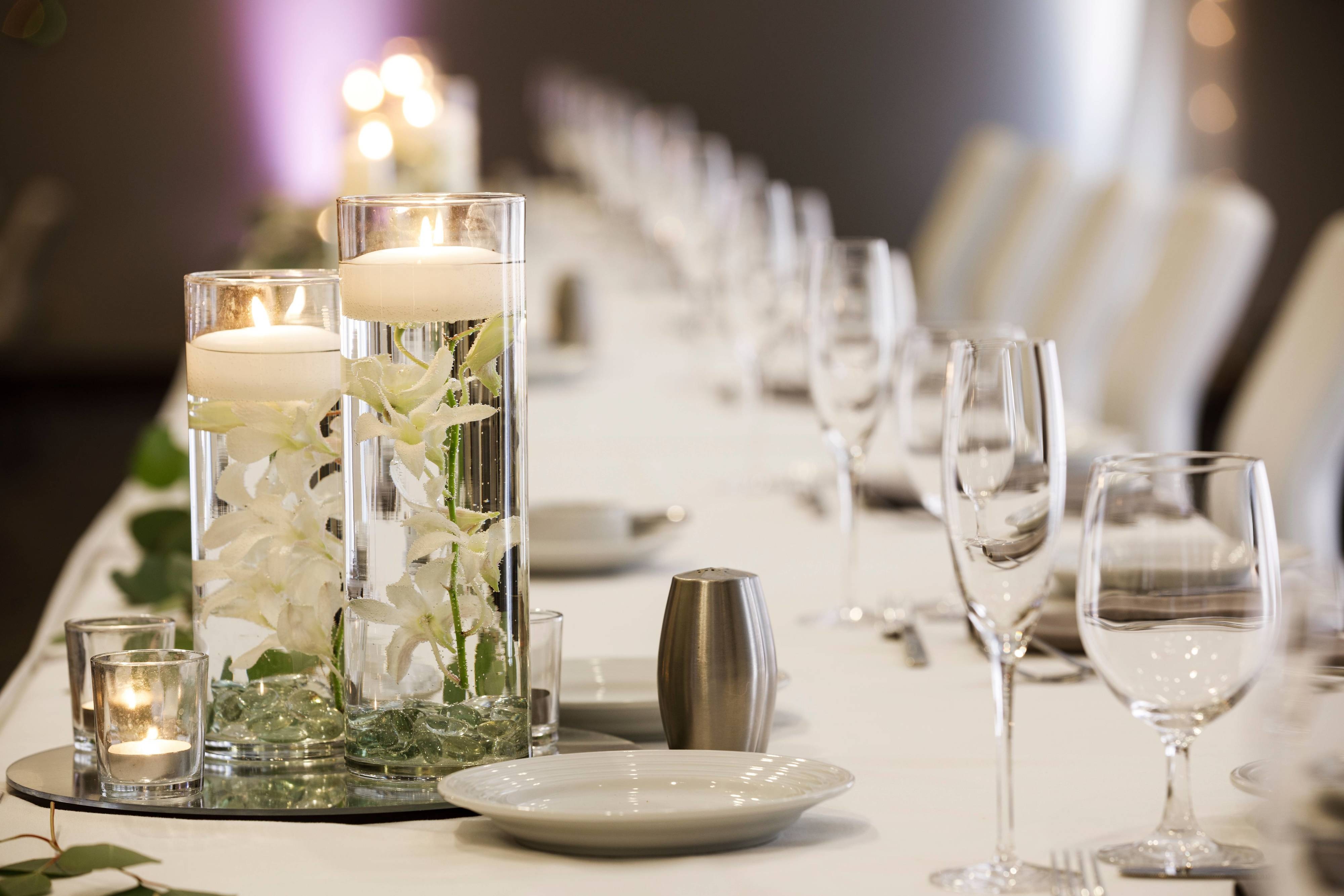 Wedding reception table candles and place settings