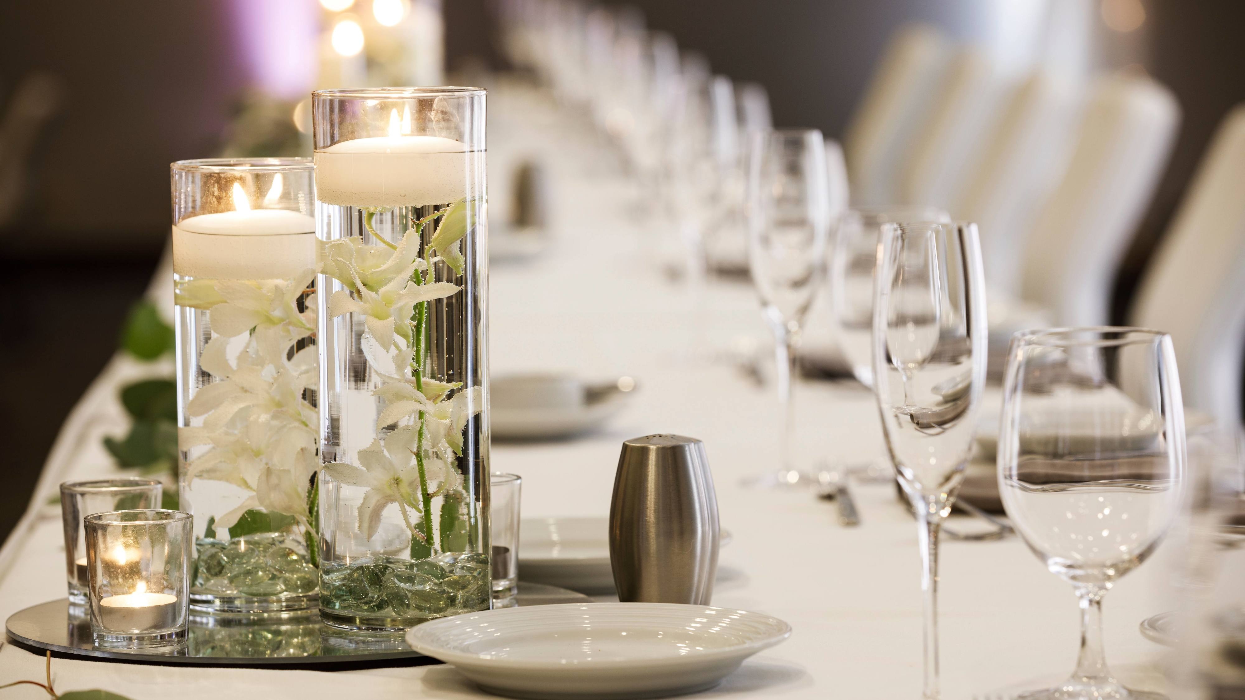 Wedding reception table candles and place settings