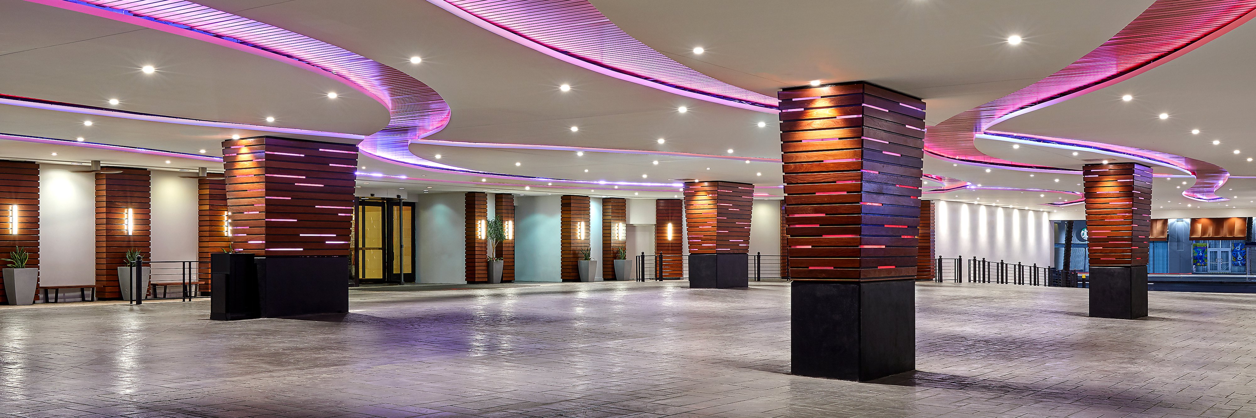 Hotel porte cochere with pink accent lighting