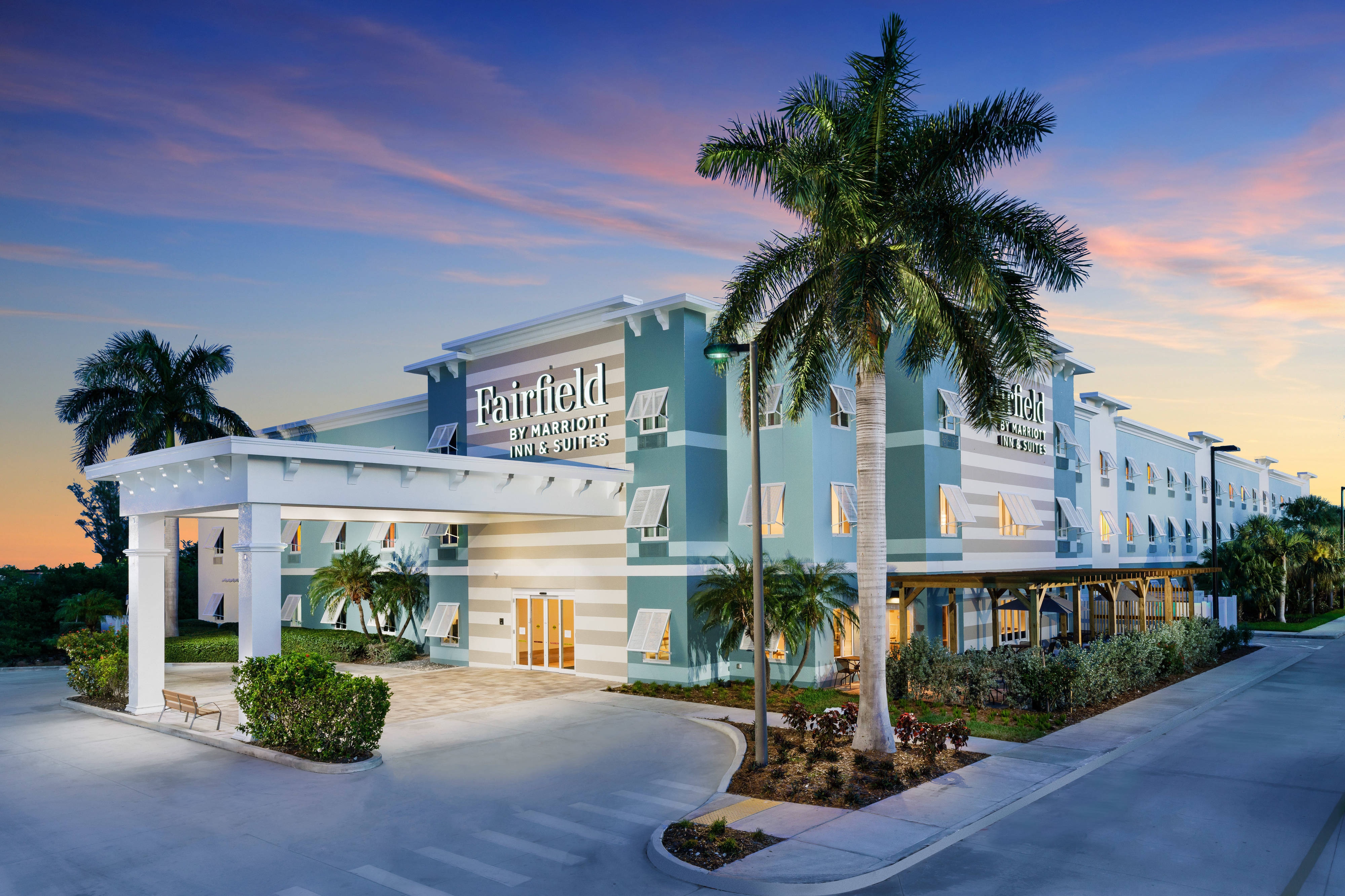 Hotel exterior sunset palm trees