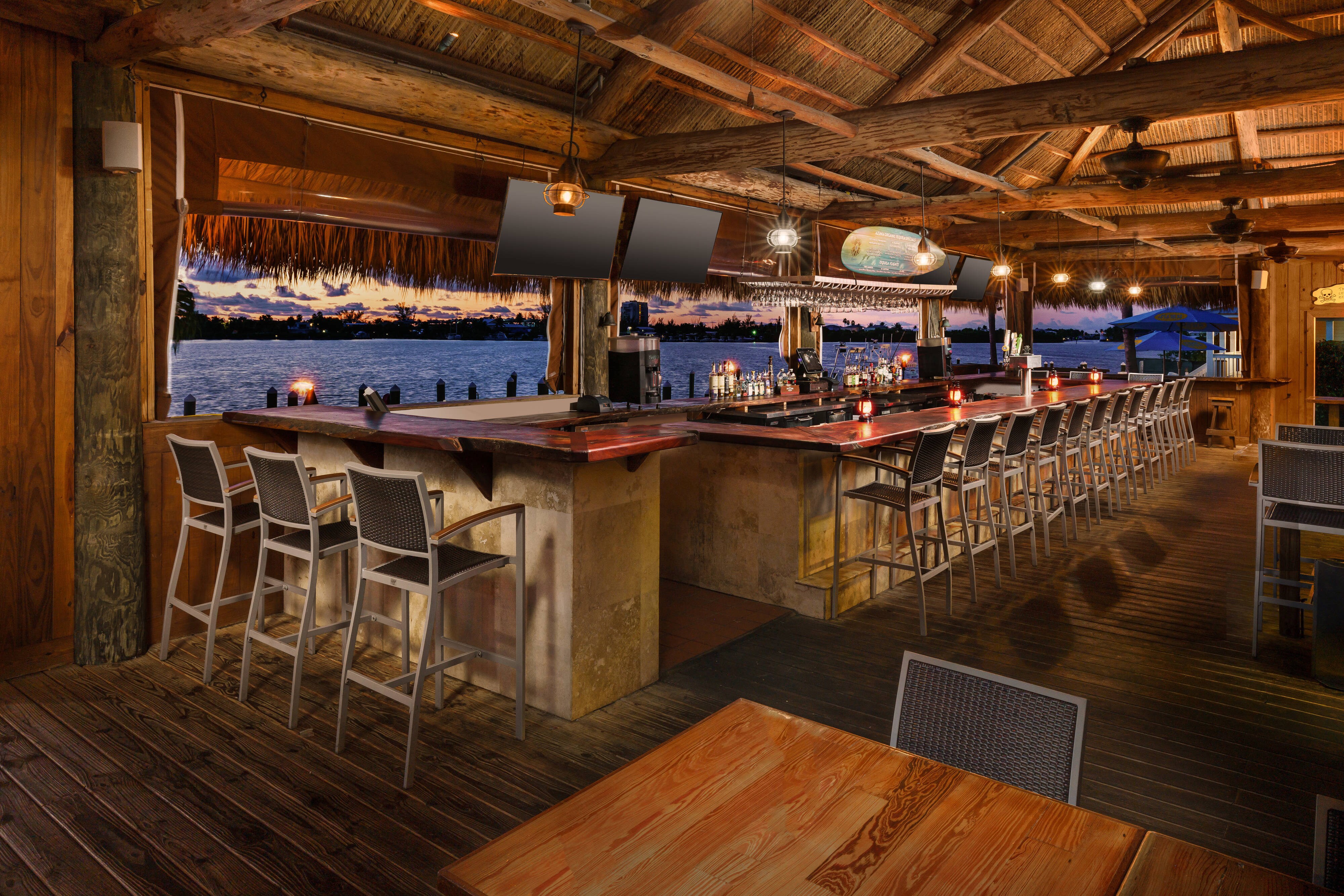 Waterfront bar with TVs