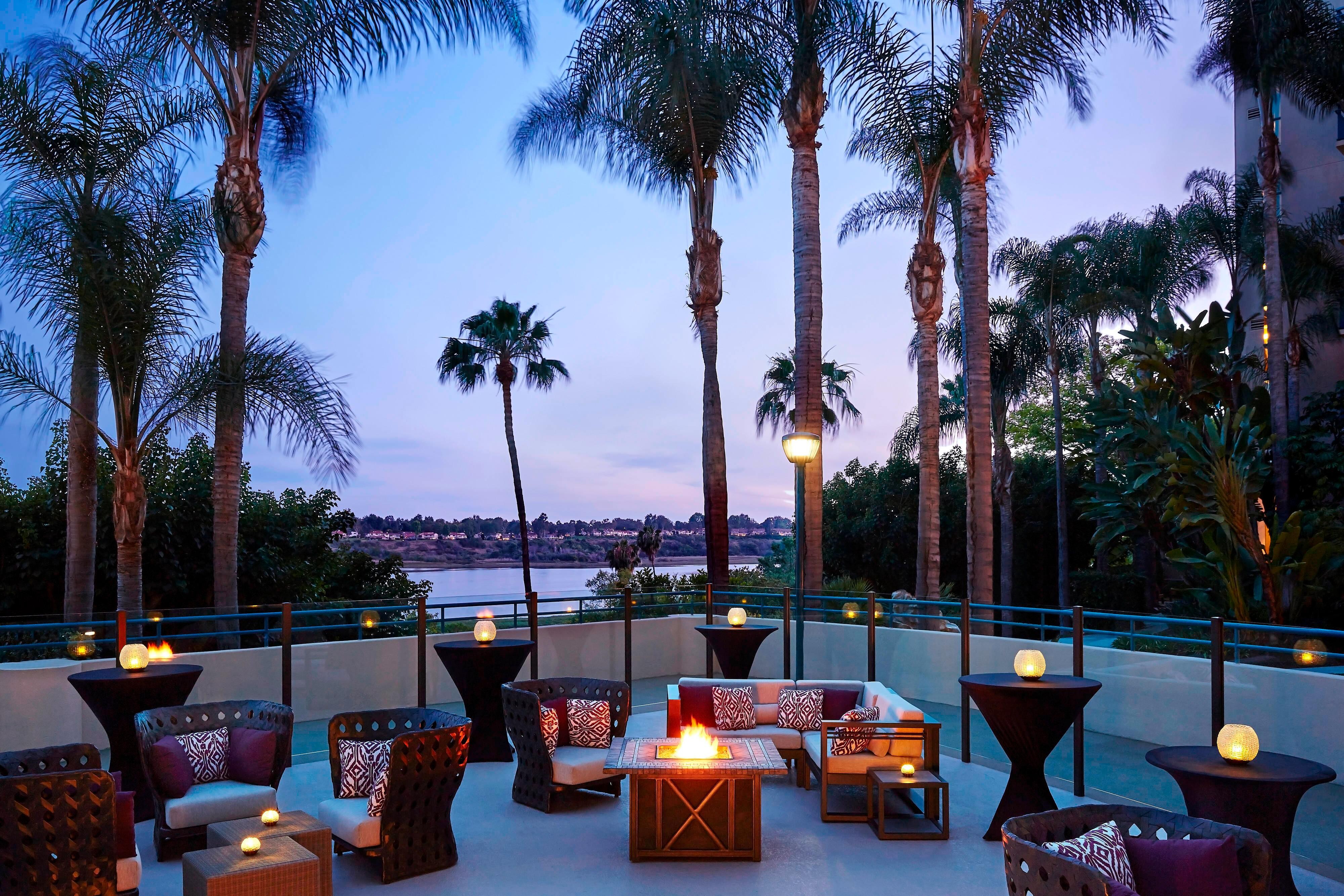 Patio with palm trees and bay view