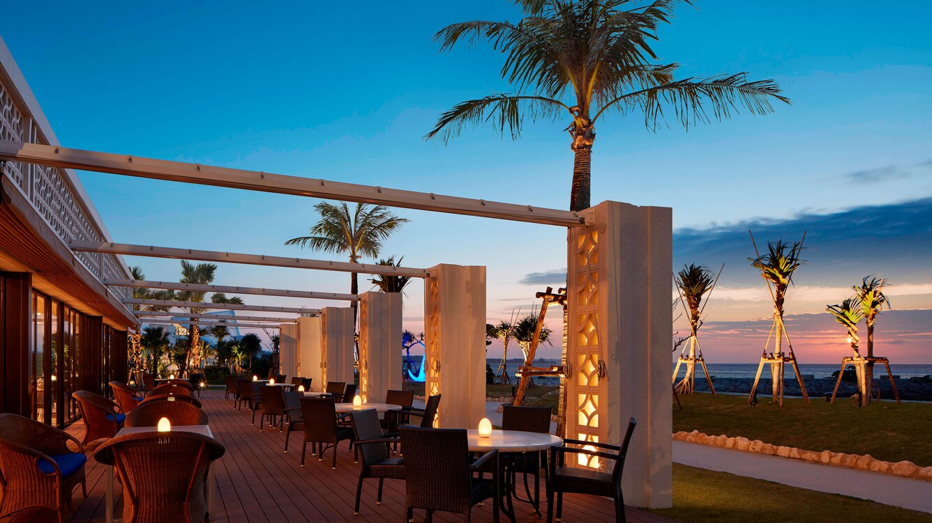 The grill outside terrace seating at dusk.
