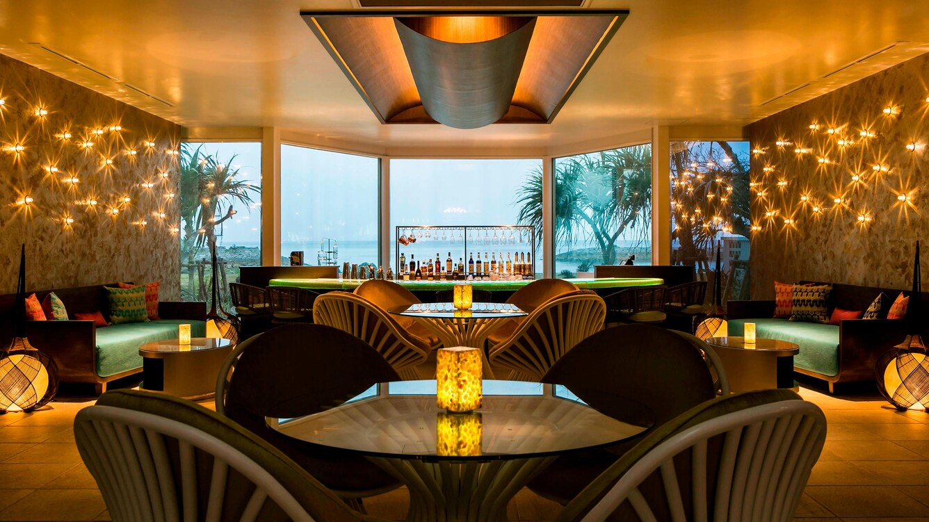 Sunset bar & terrace interior bar and lounge seating area.