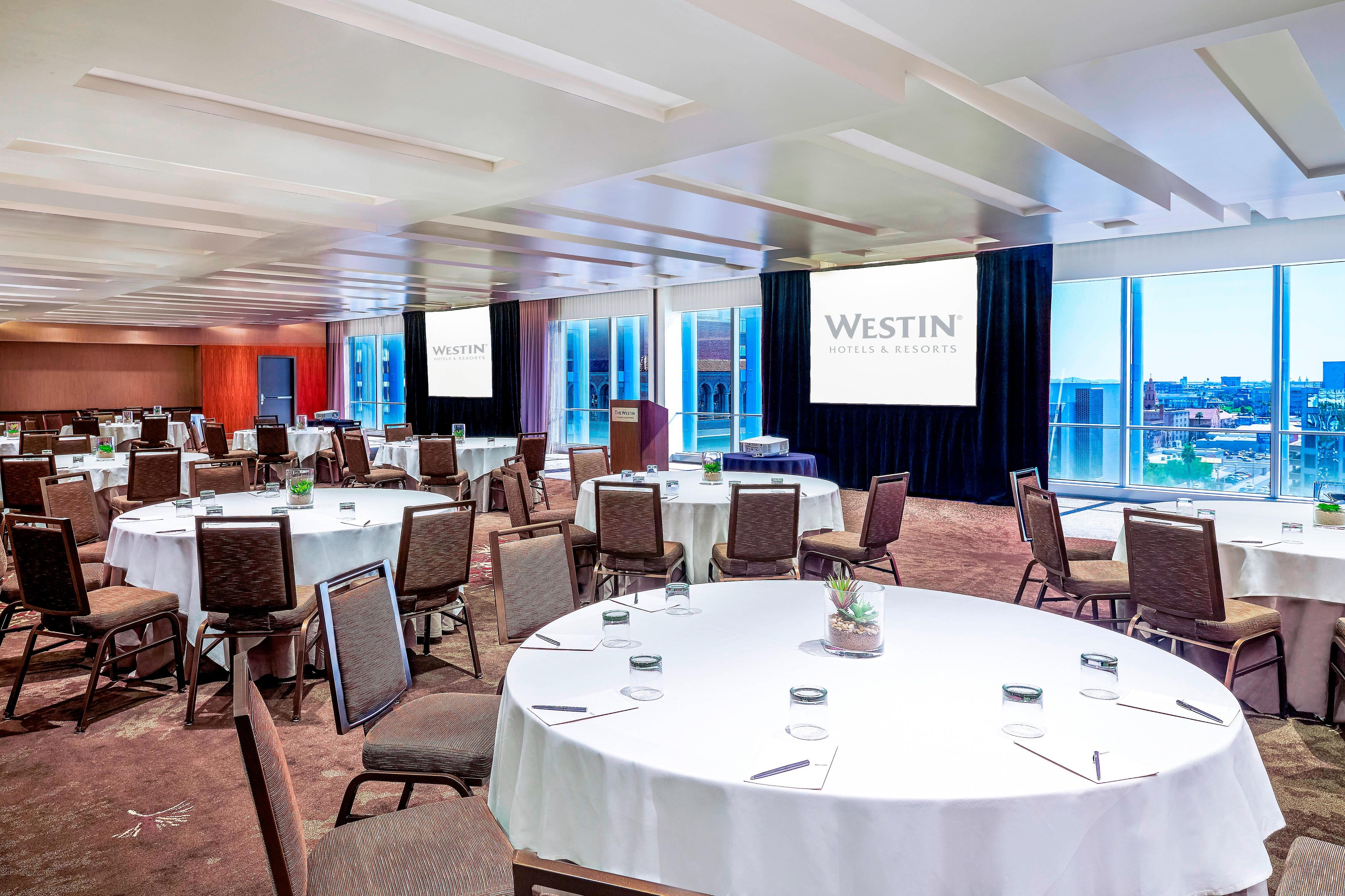 Copper ballroom banquet setup tables with city view