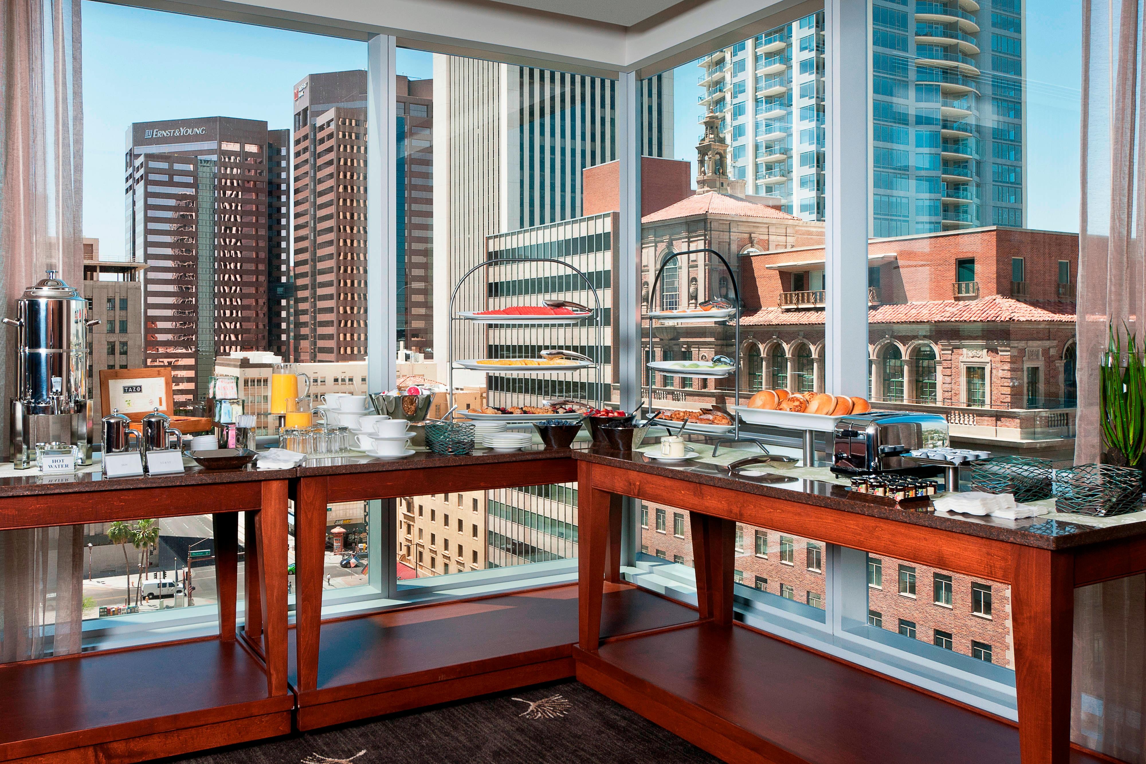 Pre function area food cart with city view.