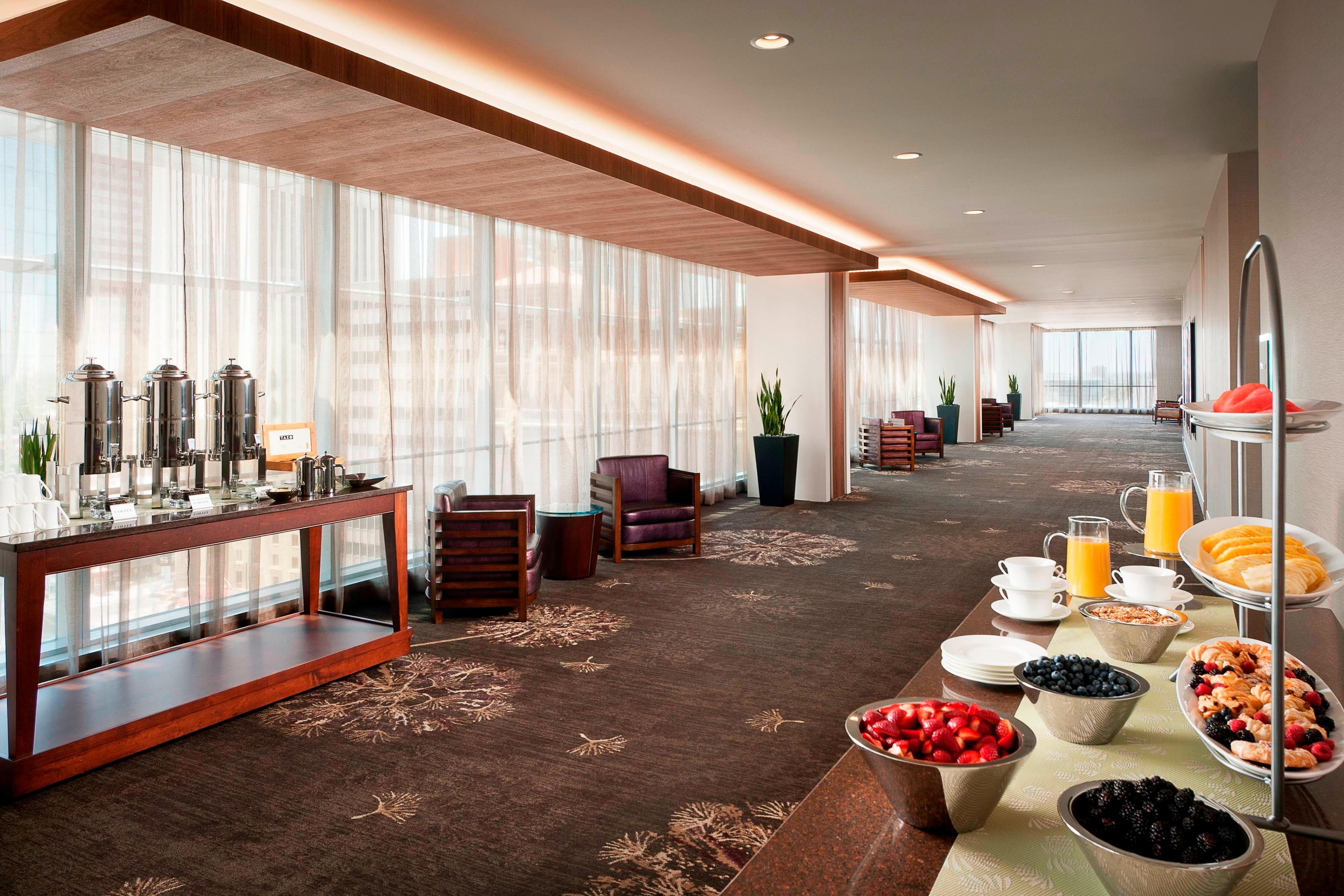 Pre function food and drink stands in hallway. 