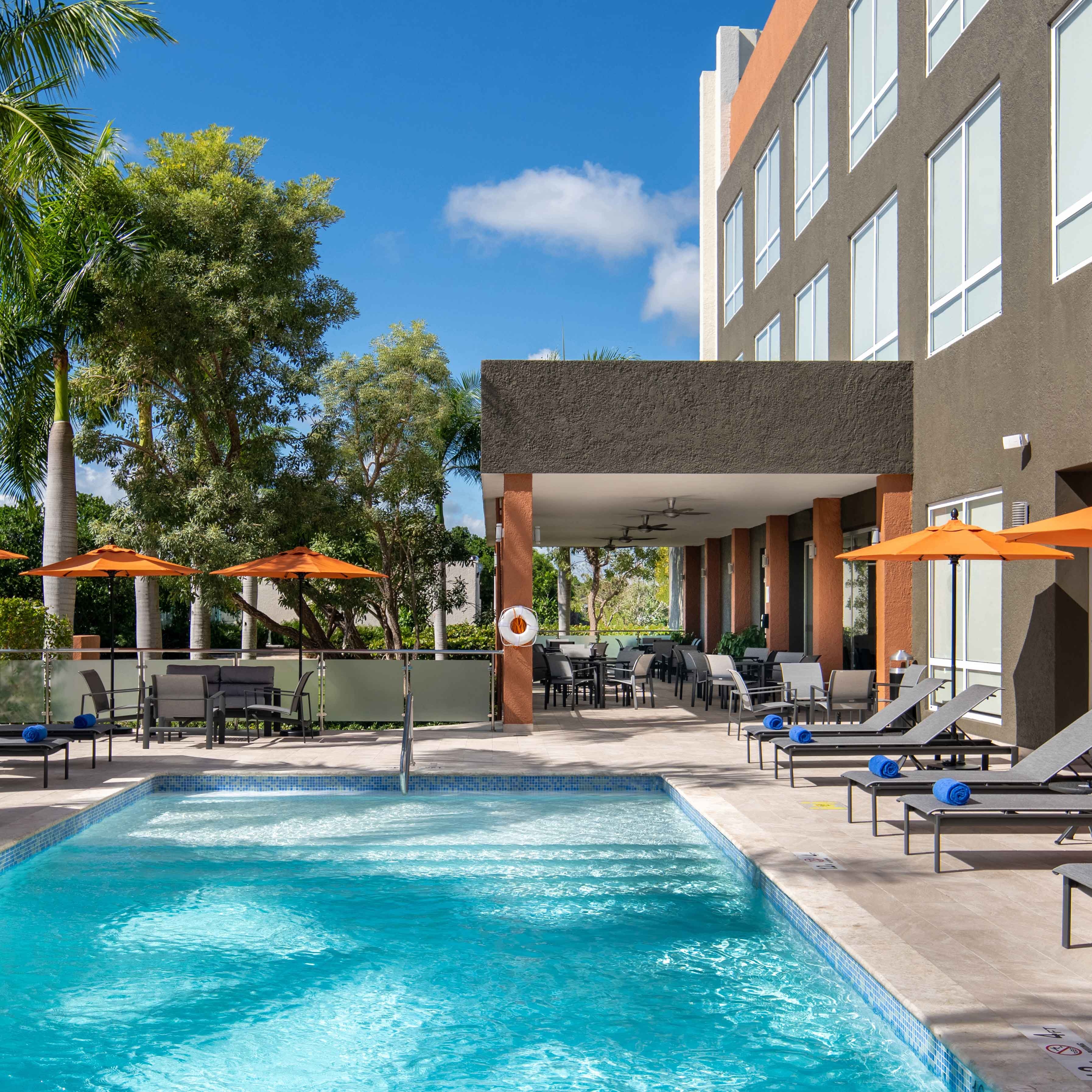 Hotel outdoor pool with lounge chairs