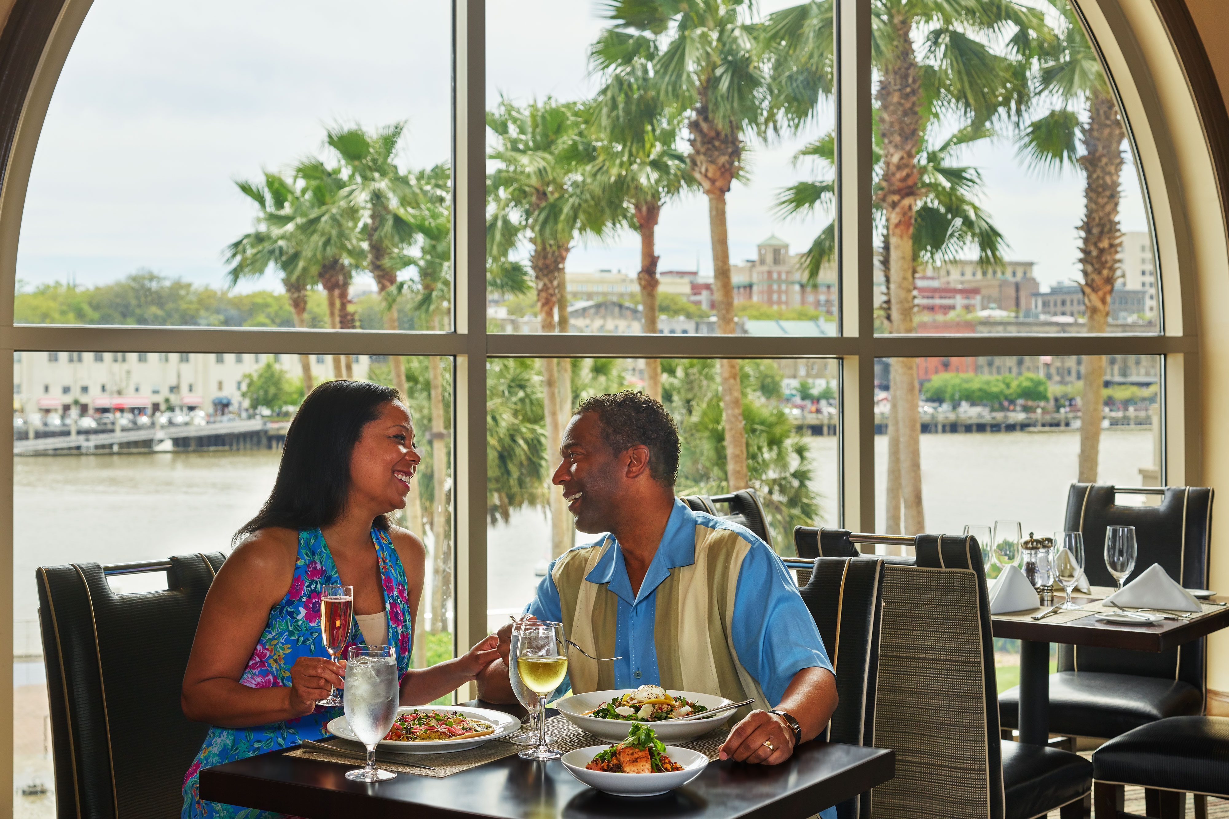 Couple smiling at each other at dinner
