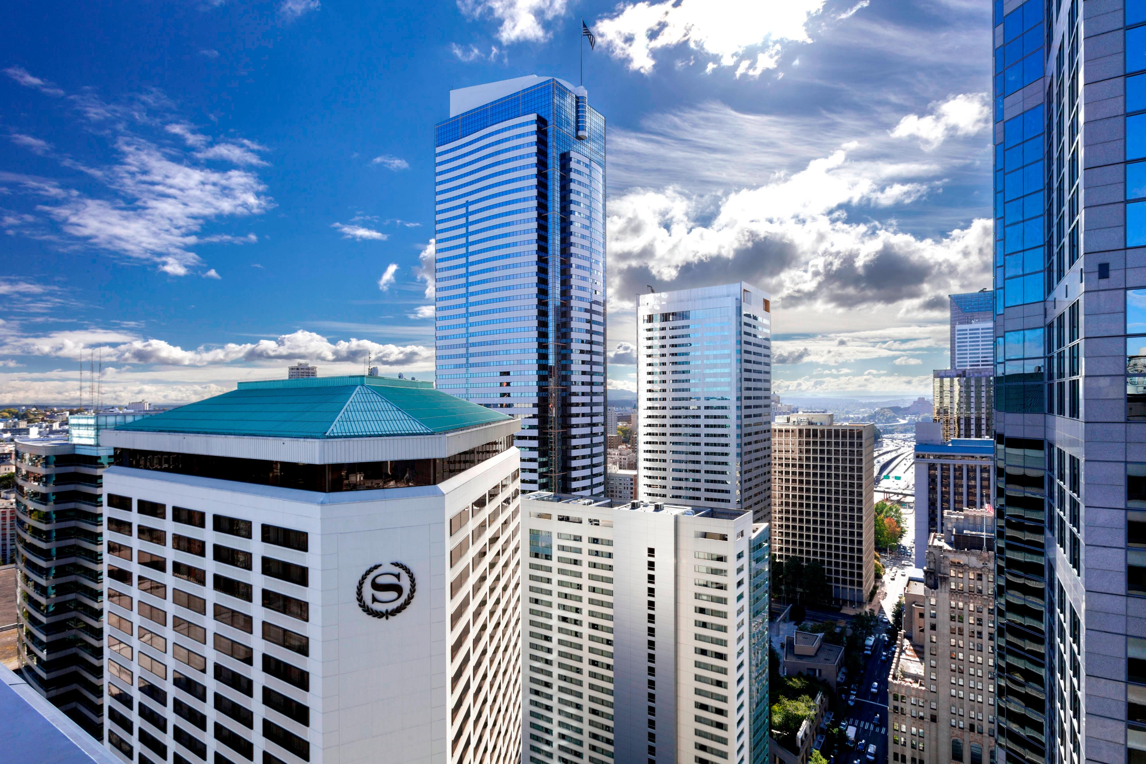Hotel exterior and Seattle skyline