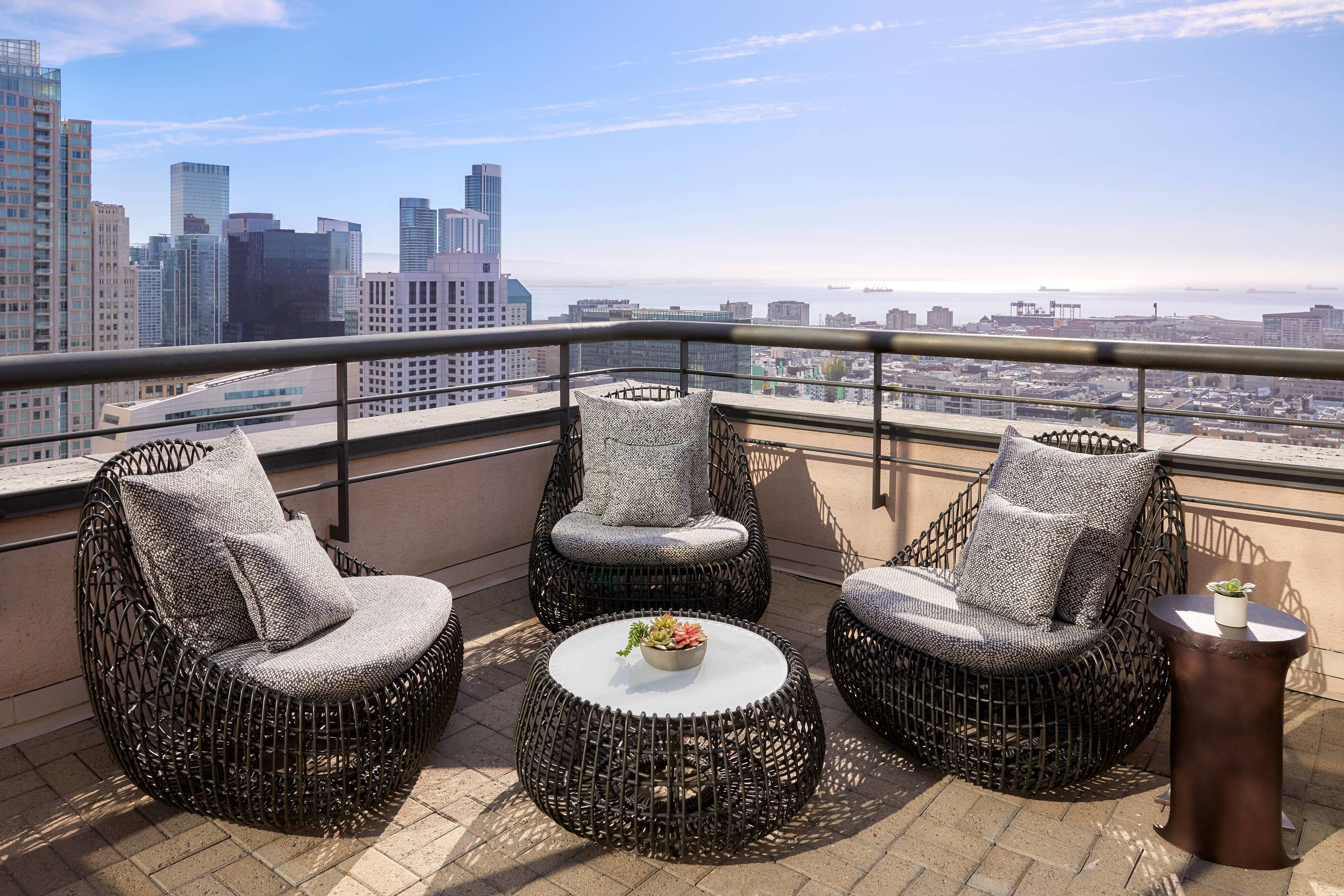 Guest suite patio seating with city views