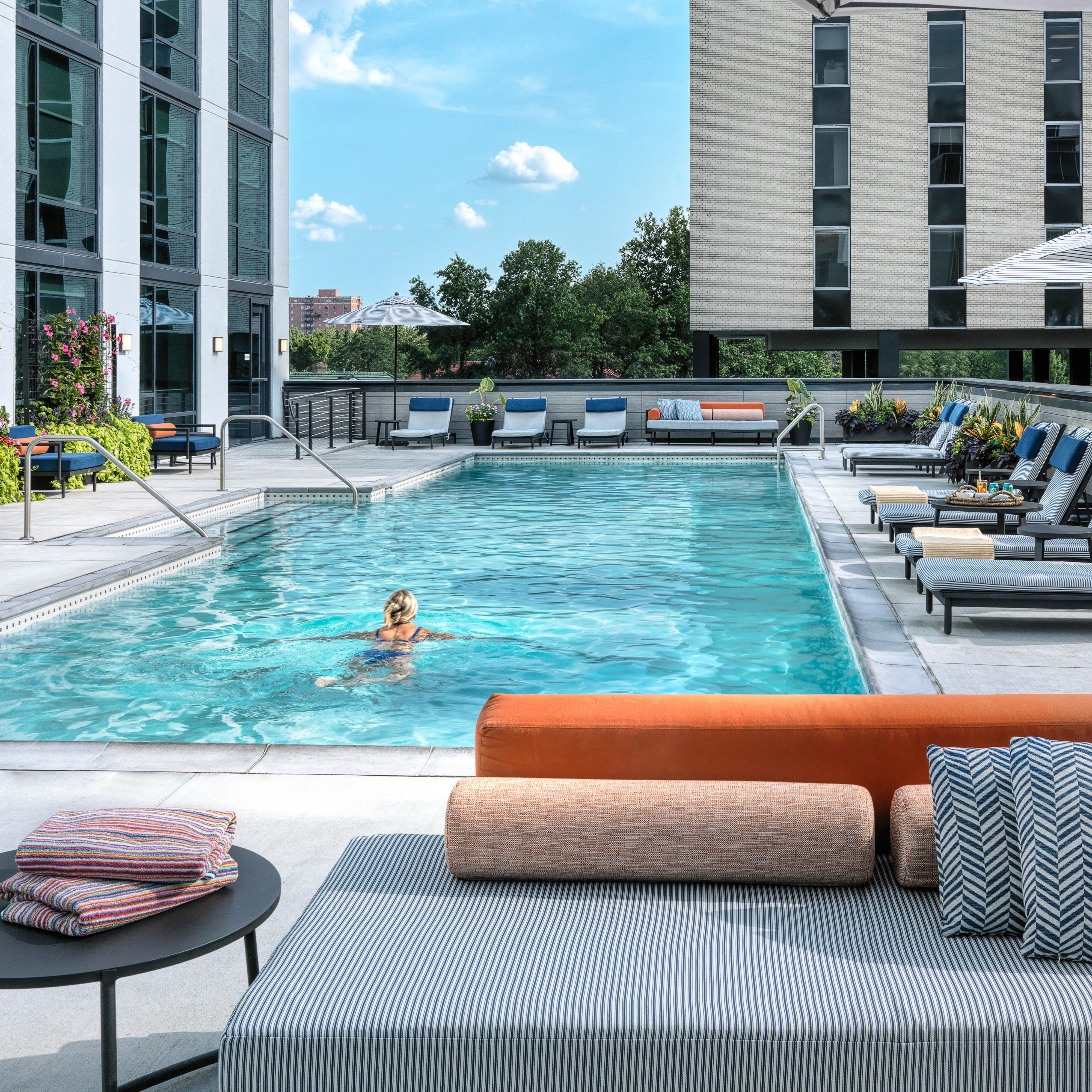 Person swimming in outdoor swimming pool