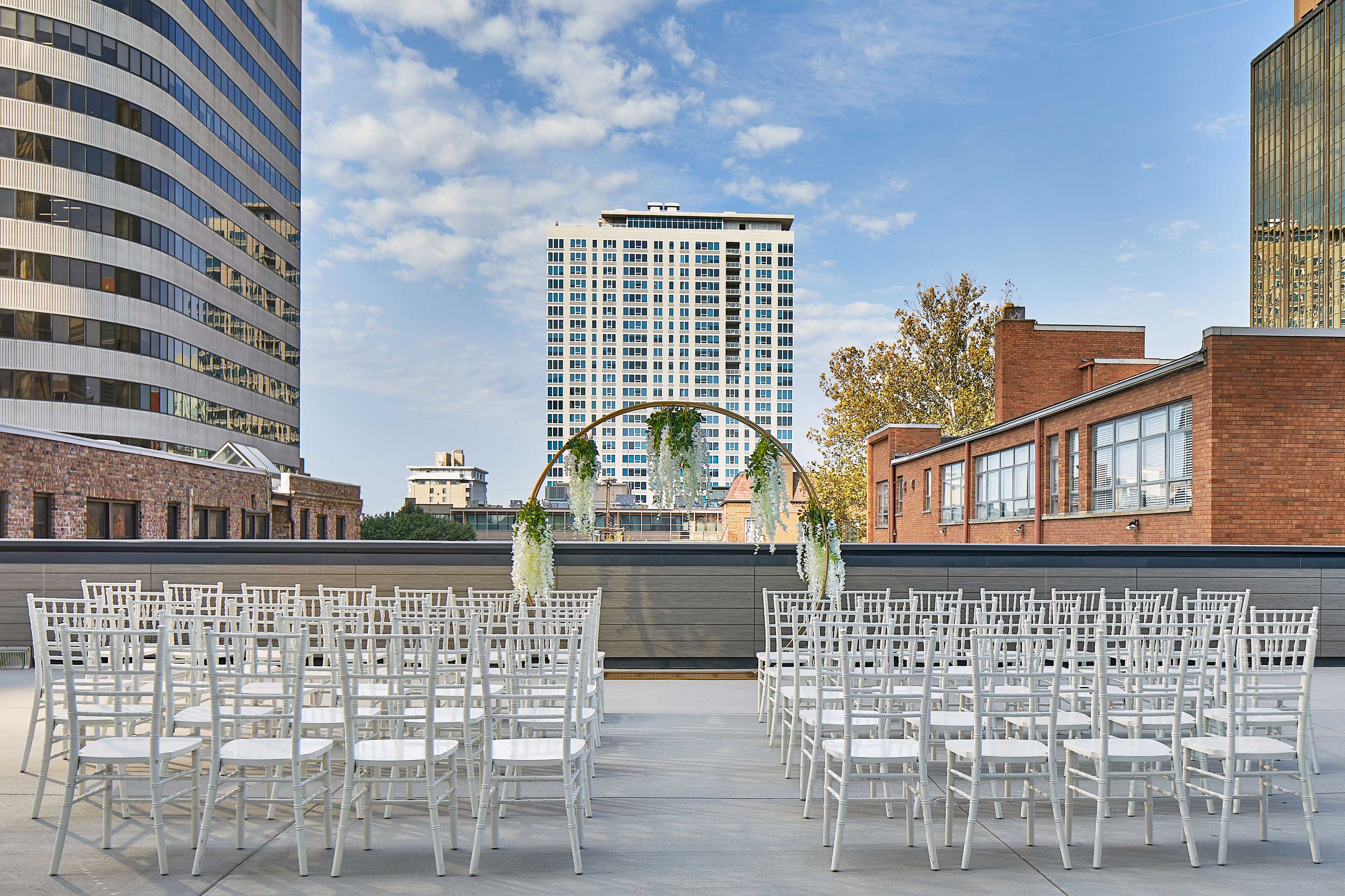 Wedding ceremony setup on outdoor pool deck