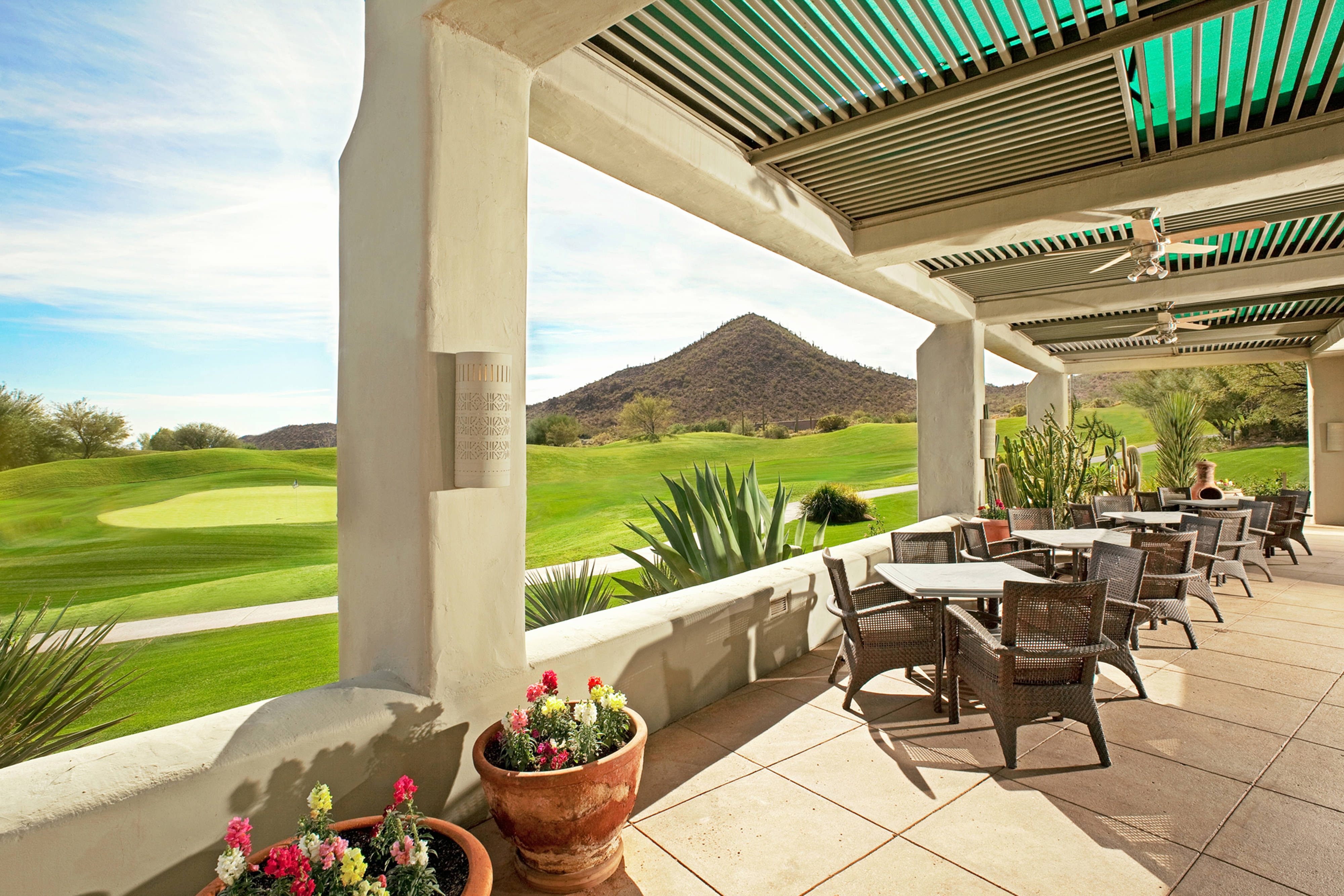 Outdoor patio beside a golf course