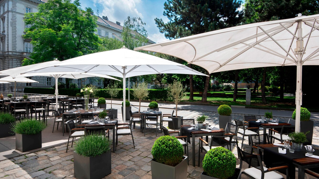 Umbrellas on a terrace patio dining area.
