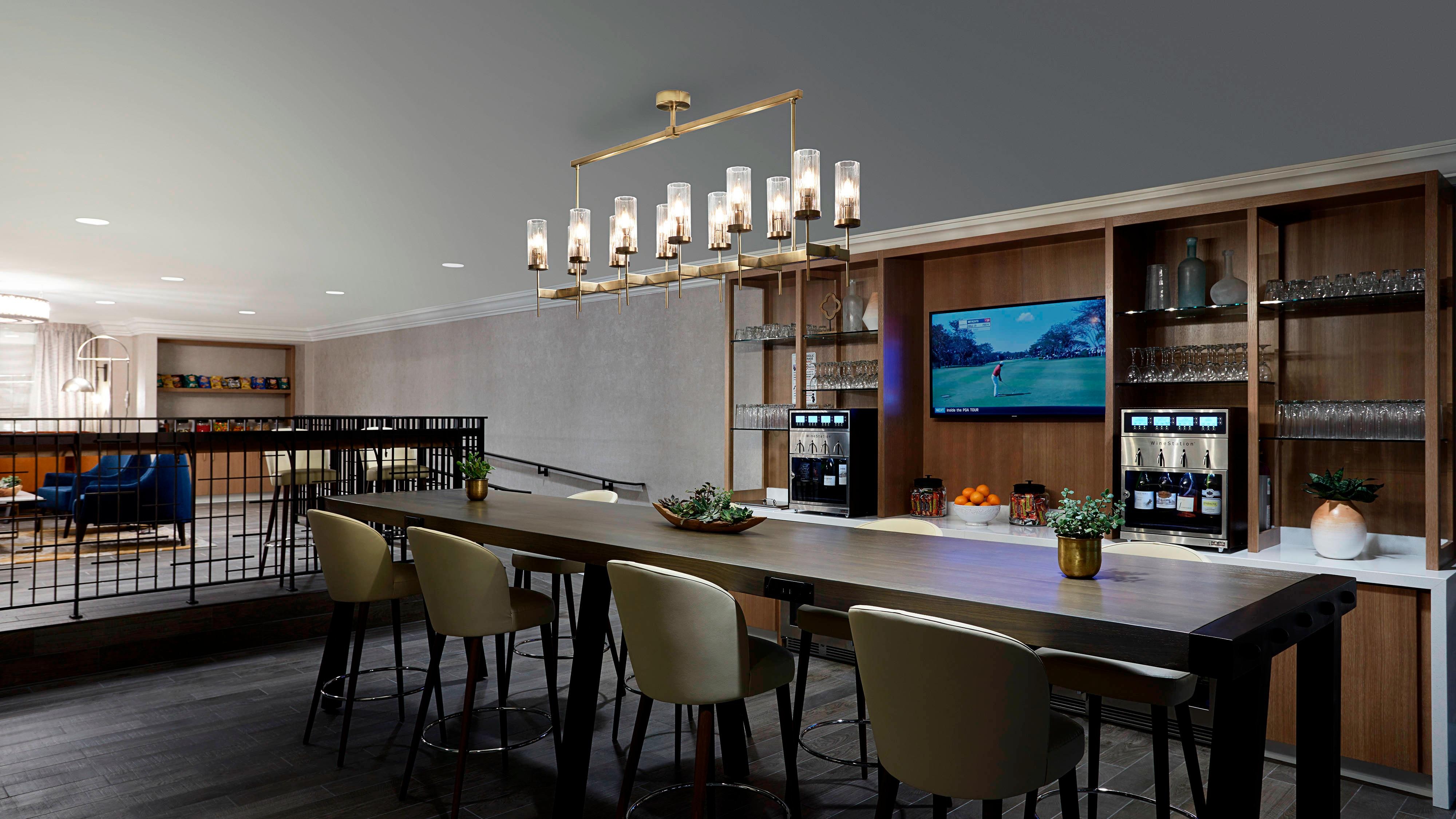 A long dining table in the M Club lounge