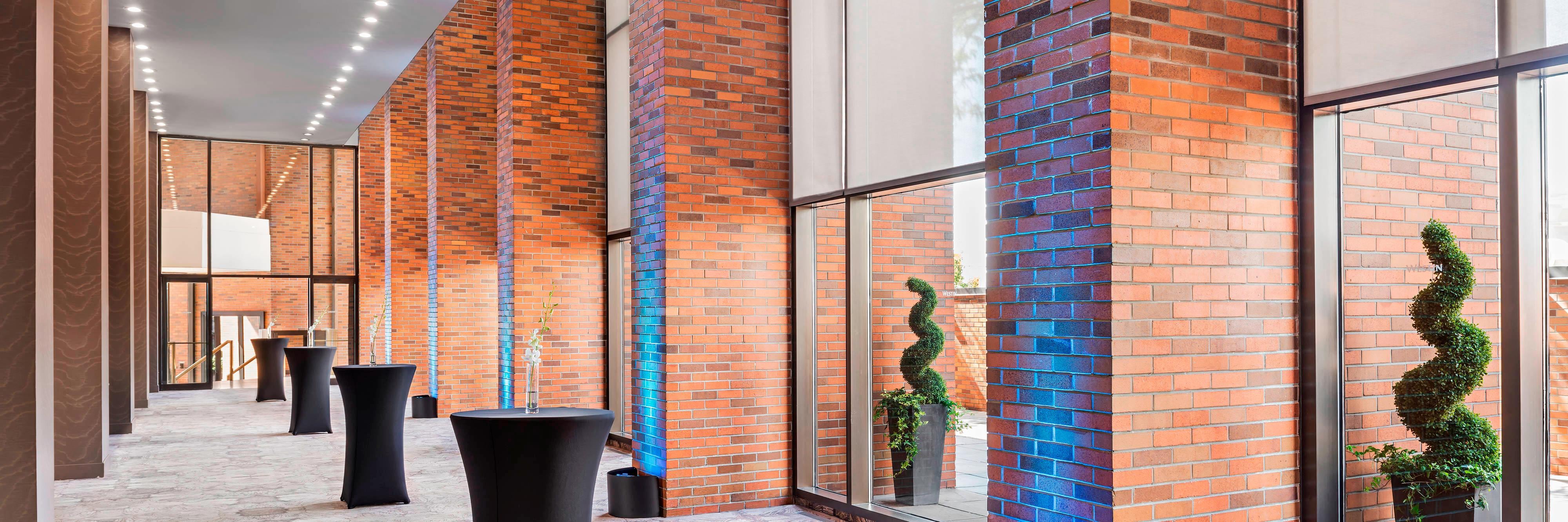 Foyer event setup with blue accent lighting