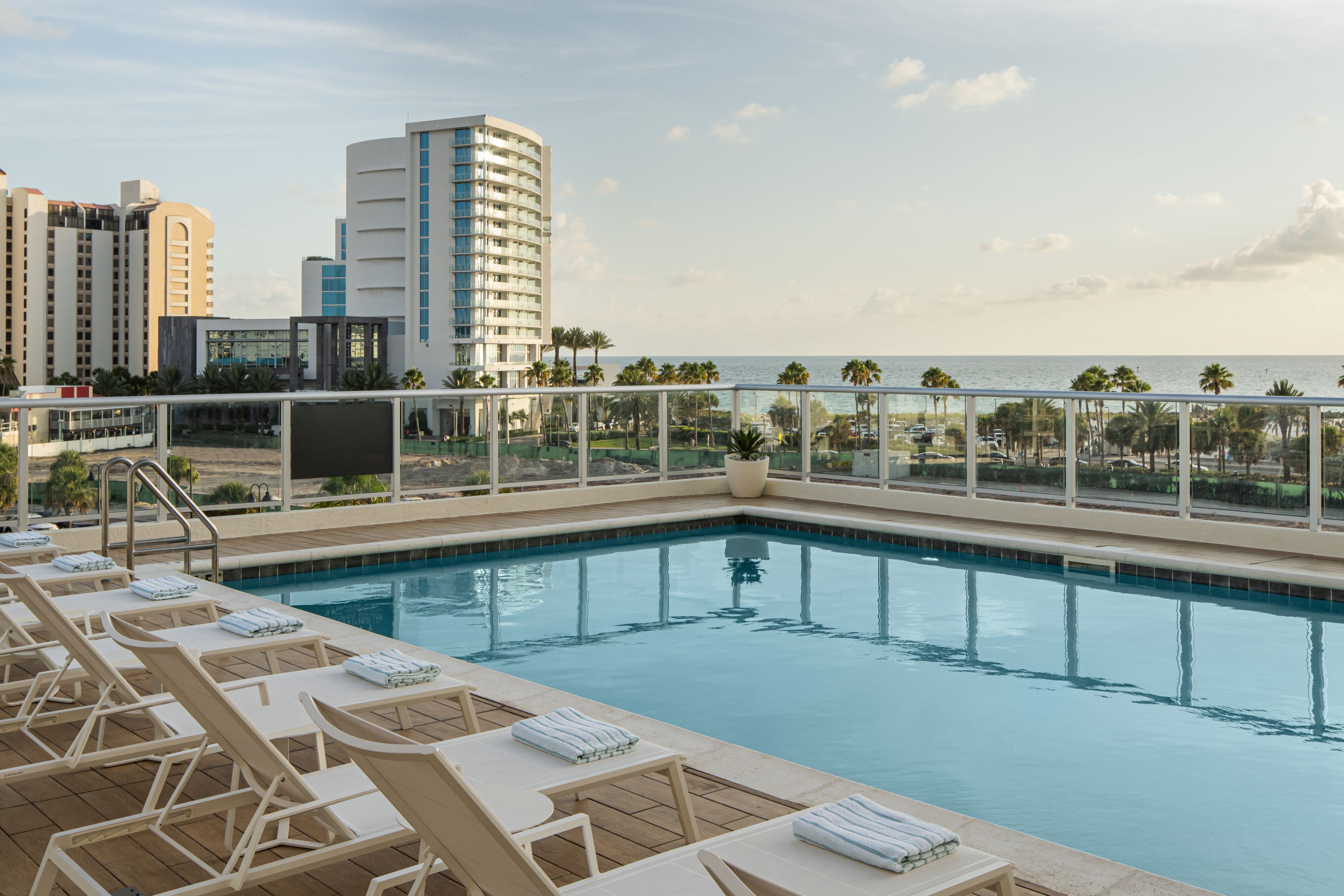 Rooftop pool with lounge chairs