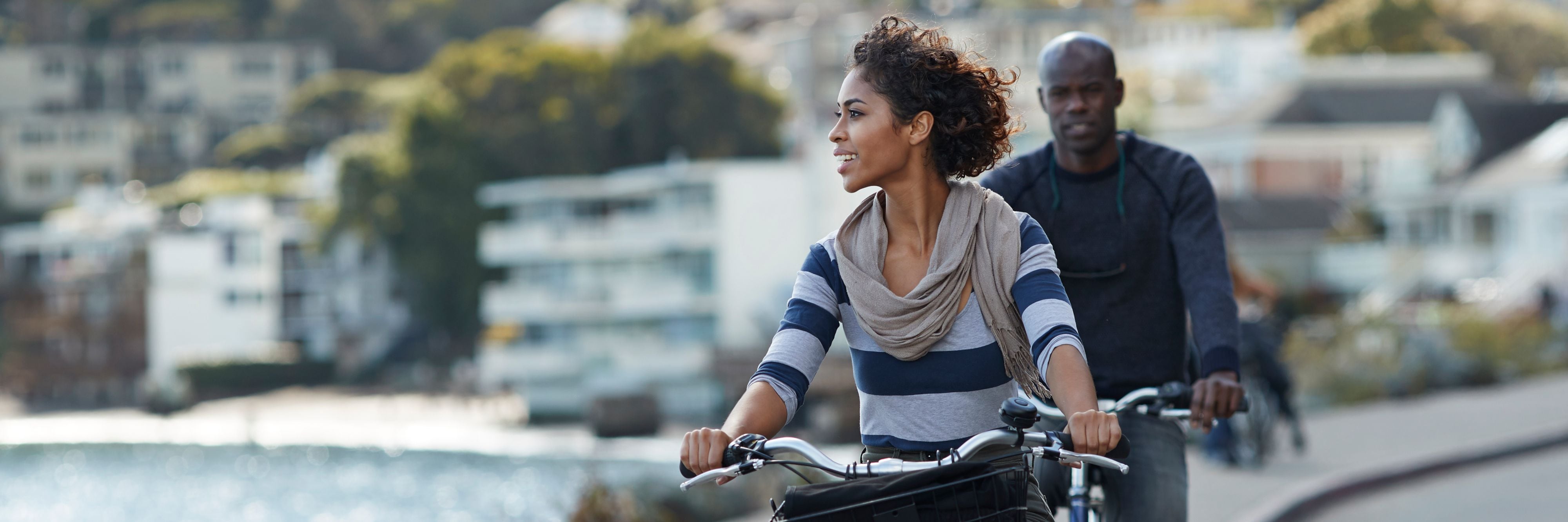 Couple using rental bikes in the small town