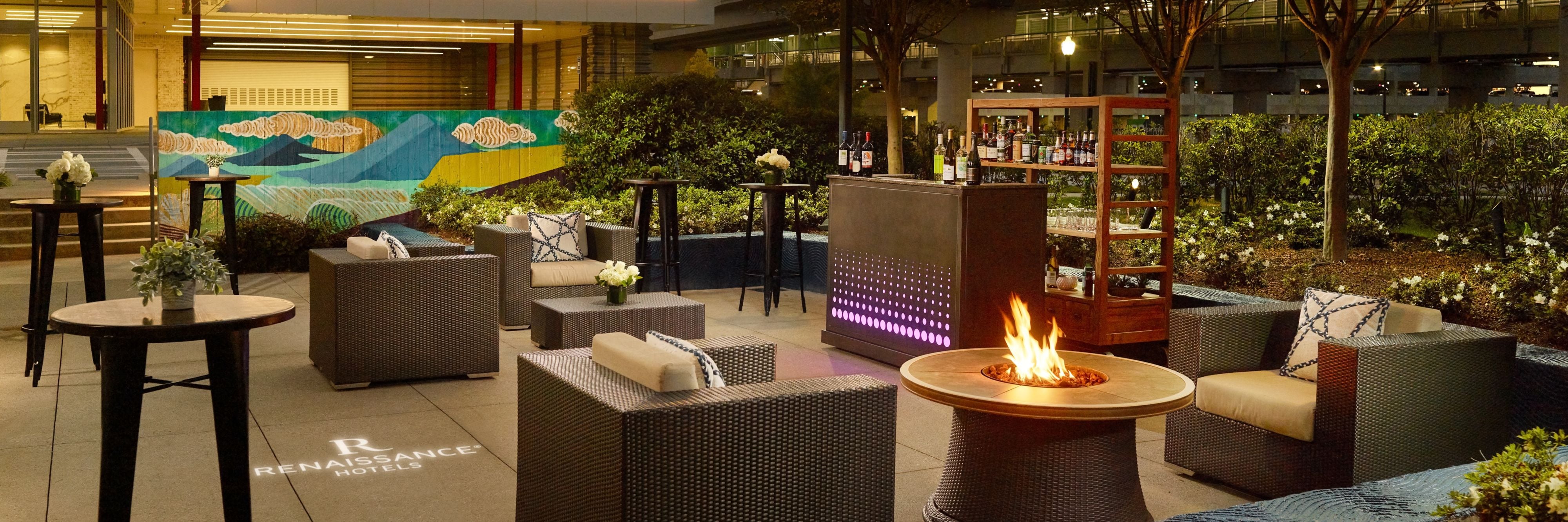 Outdoor terrace reception with firepit and bar