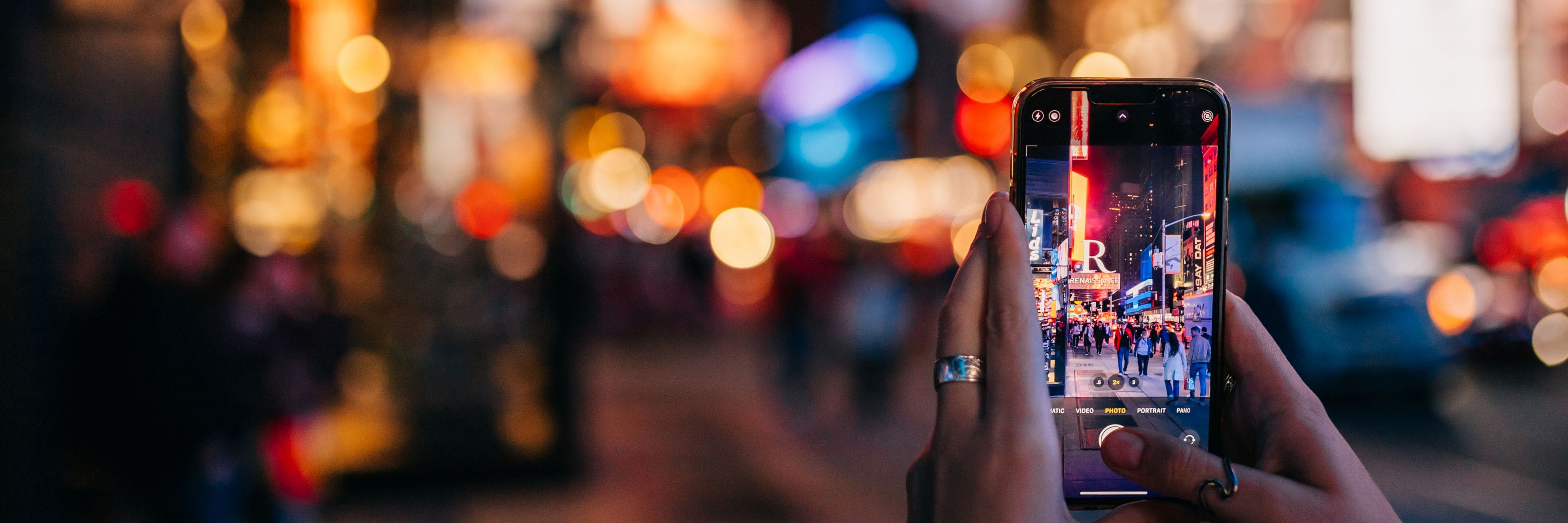 Person taking a photo on street of New York