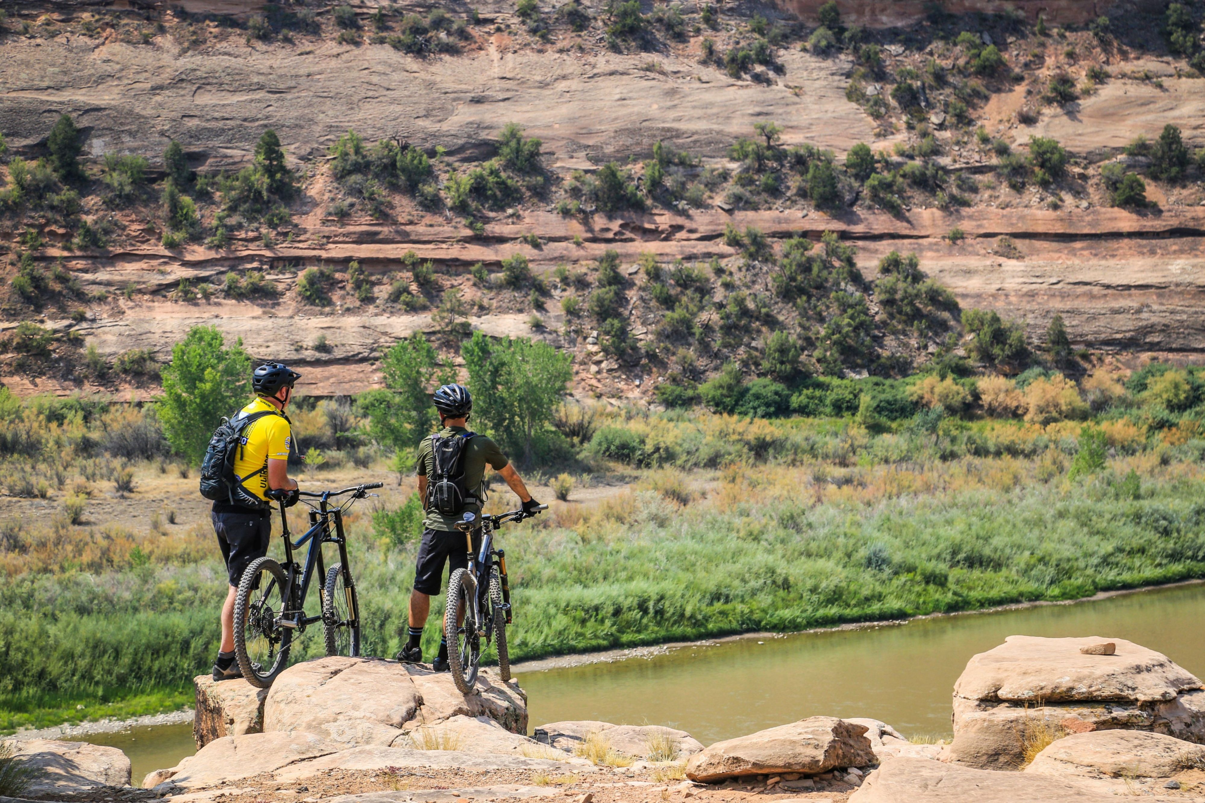 People mountain biking