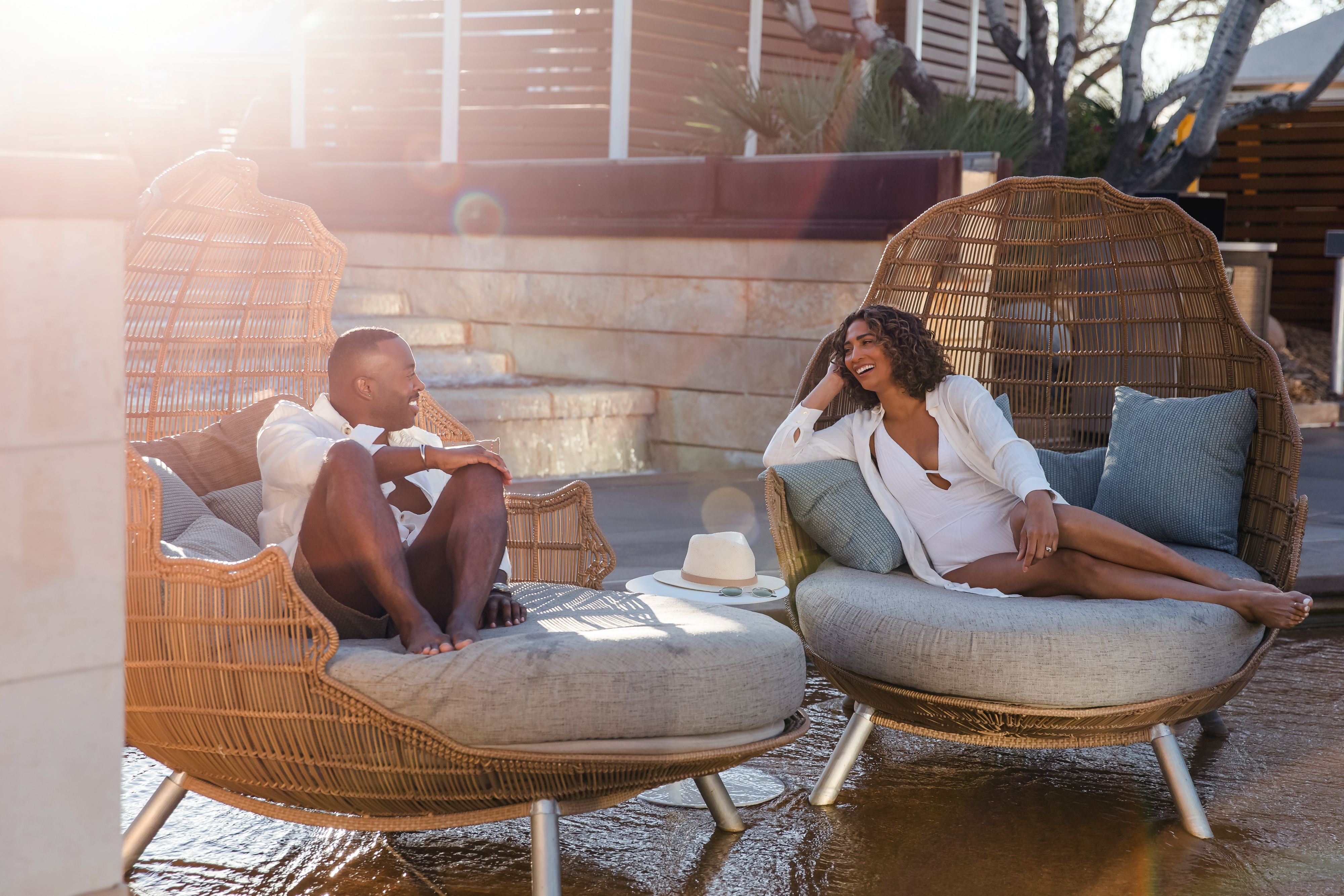 Couple lounging in oversized chairs
