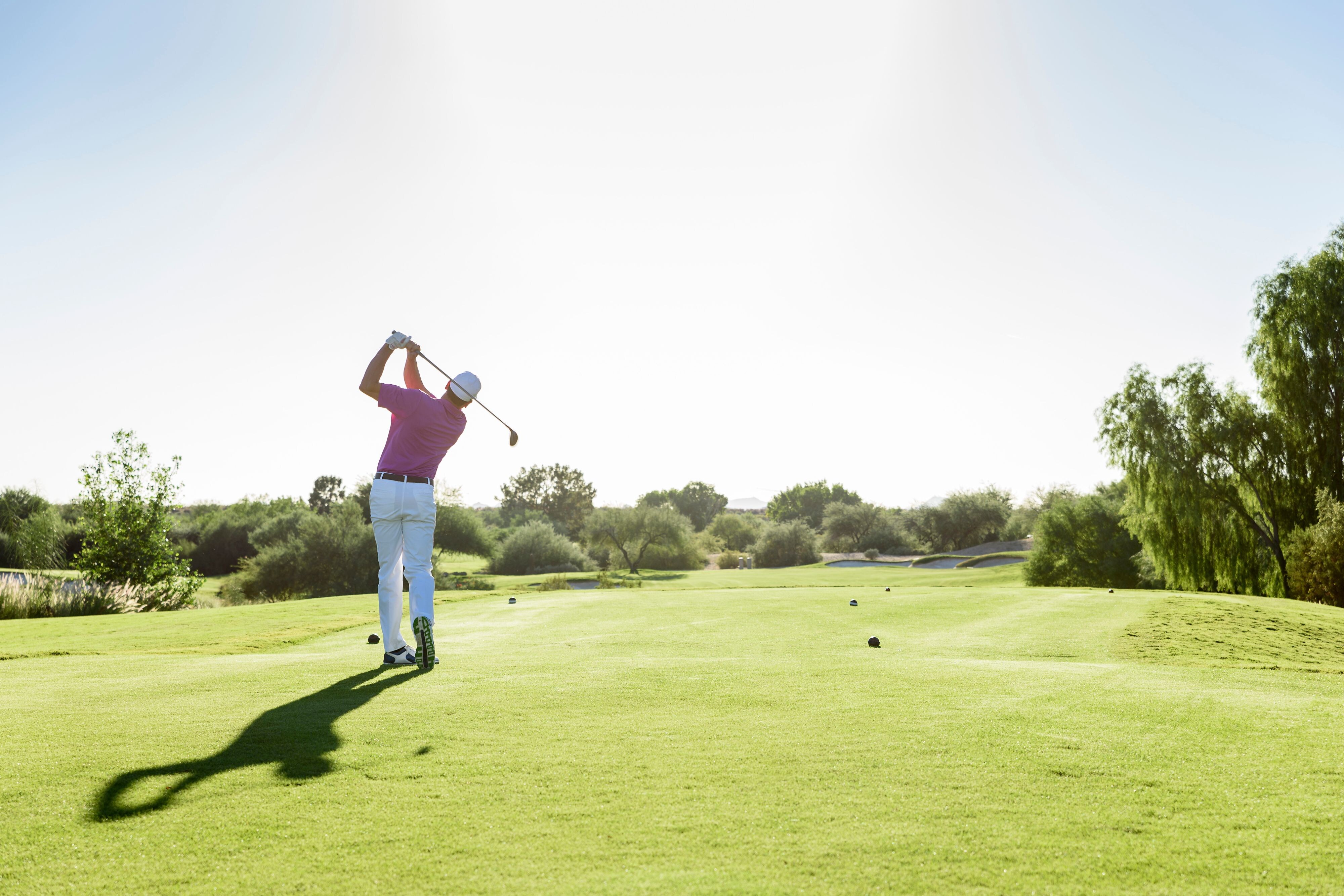 Person golfing