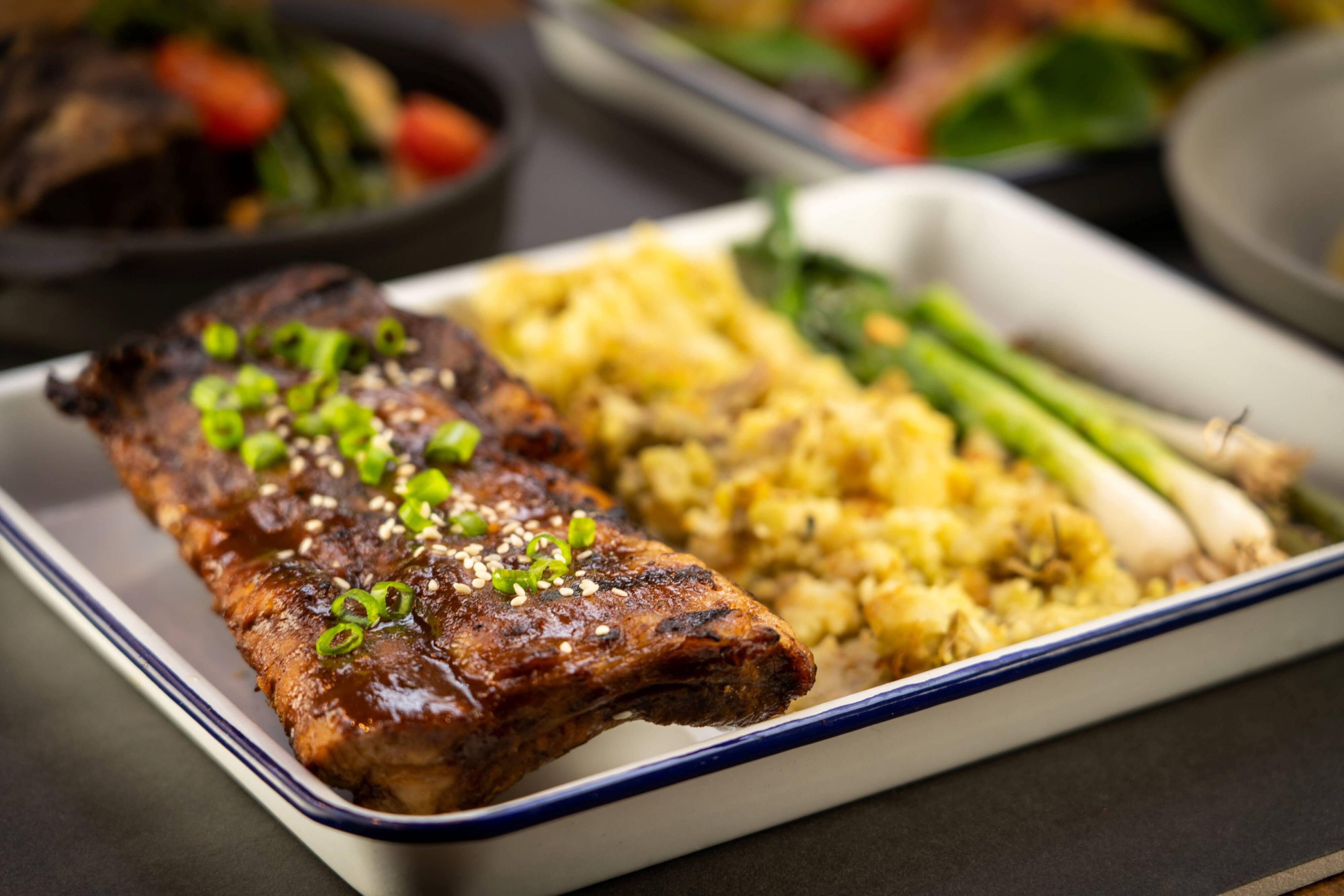Plate of ribs with side dishes