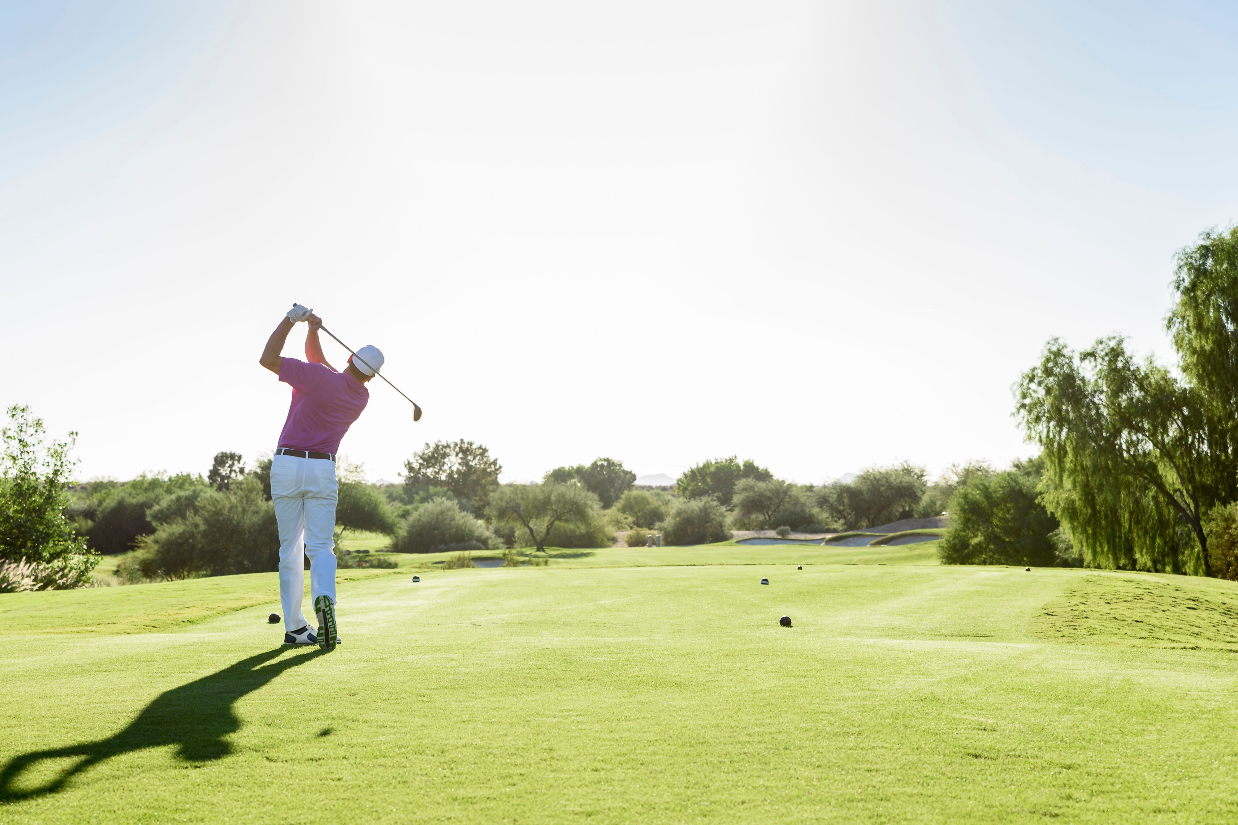 Person golfing