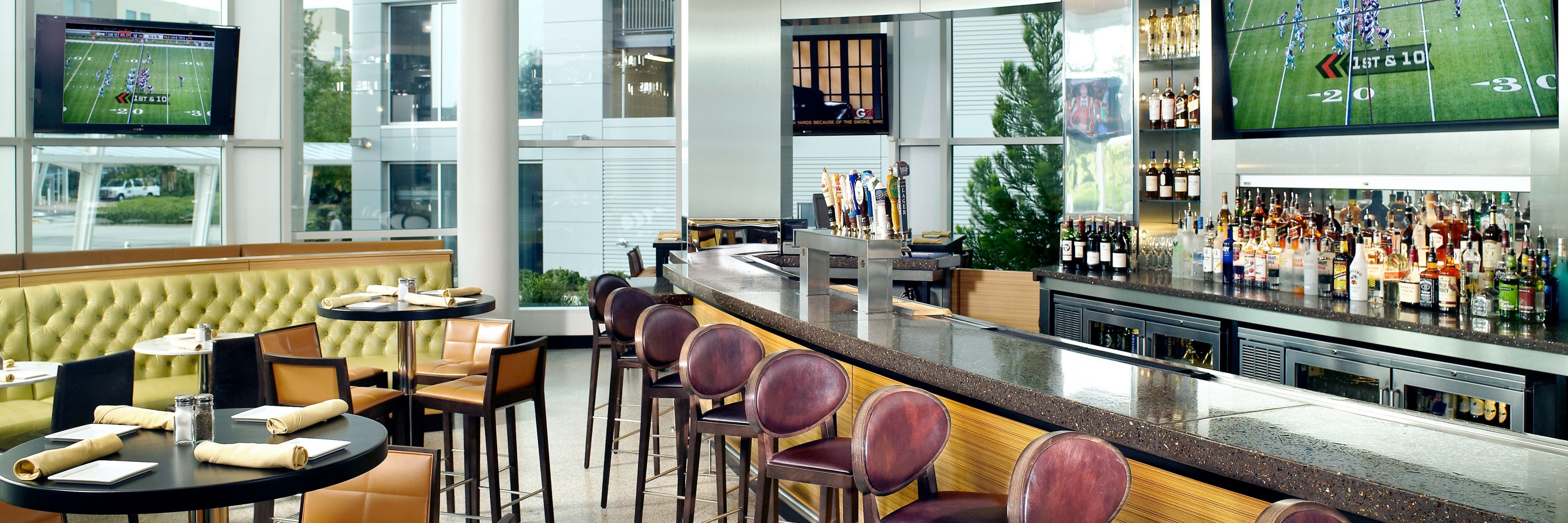 Bar with TV and floor to ceiling windows