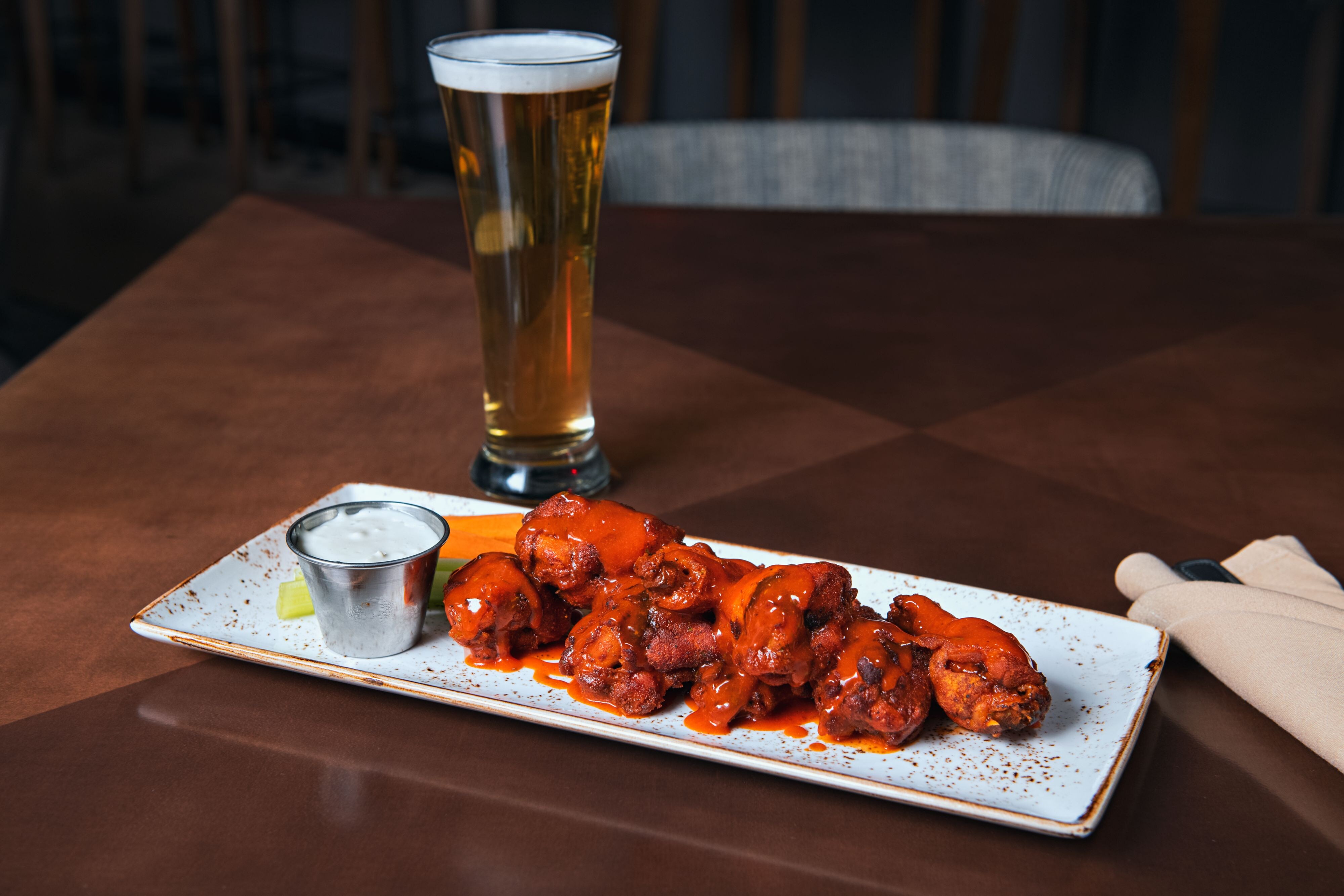 Nosh on delicious appetizers and cold beer.