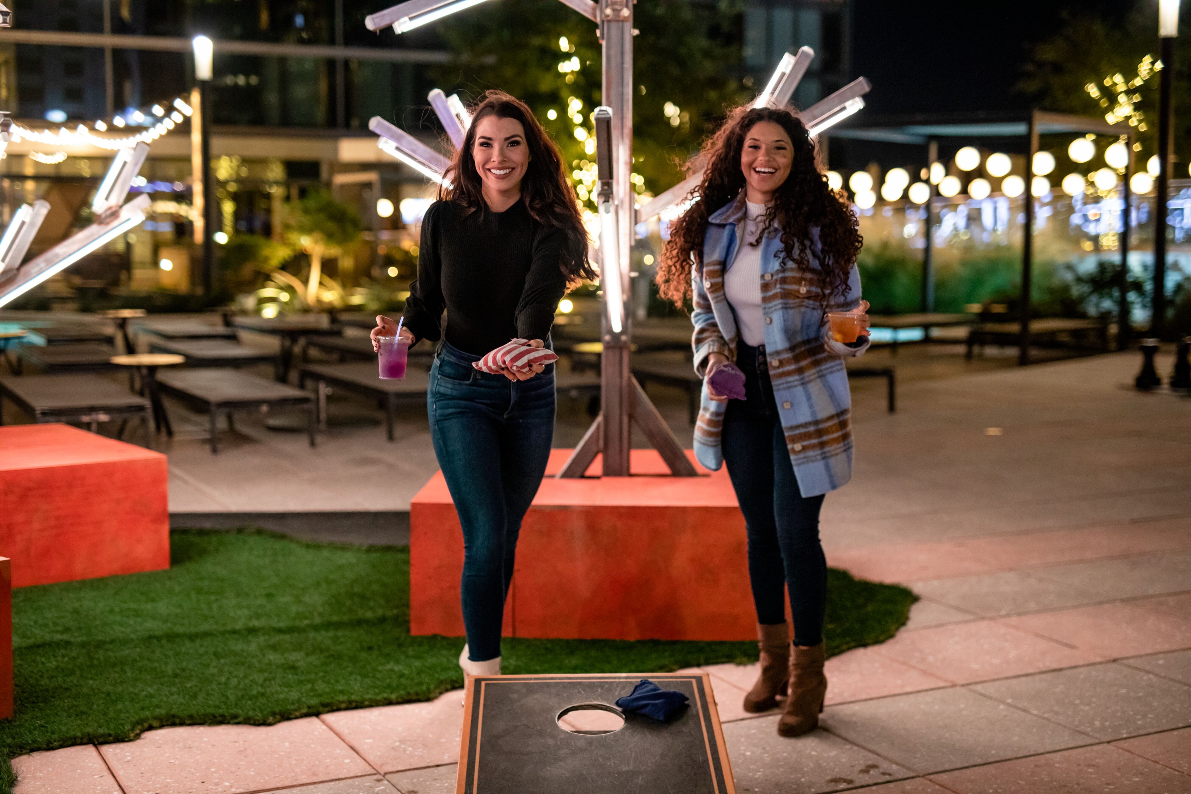 Women playing Cornhole