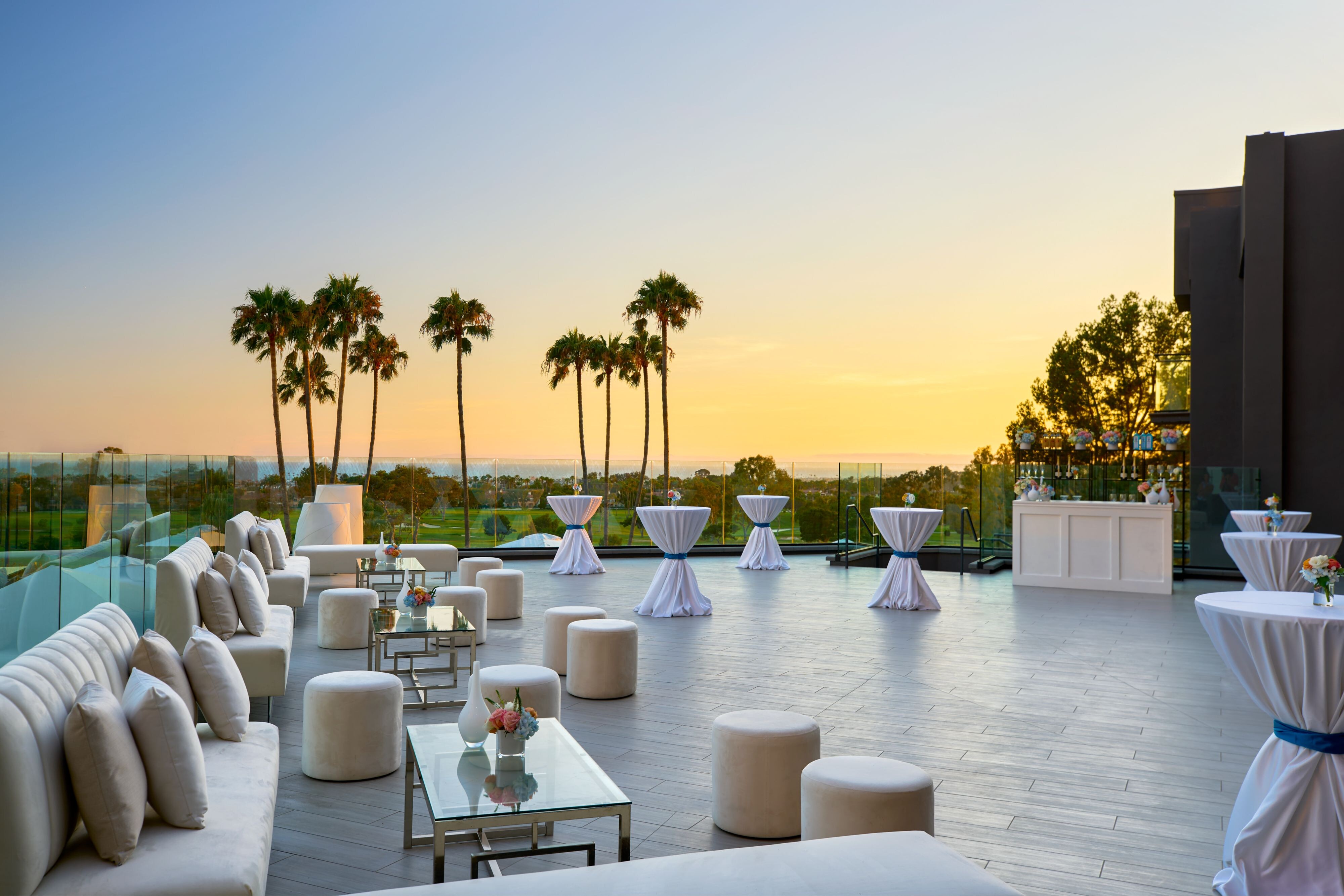 Outdoor lounge seating at sunset