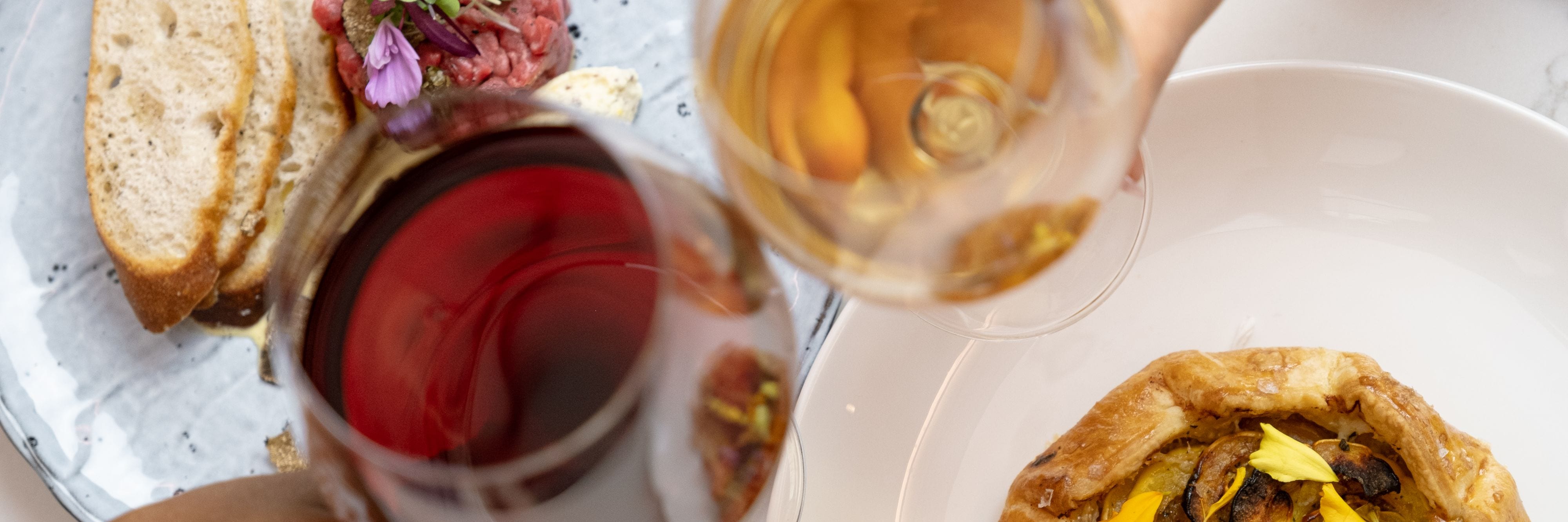 People toasting with wine glasses